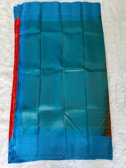 Gadwal Pattu Saree Red-colored saree complemented with a Blue border - Sampradaya Designer Studio