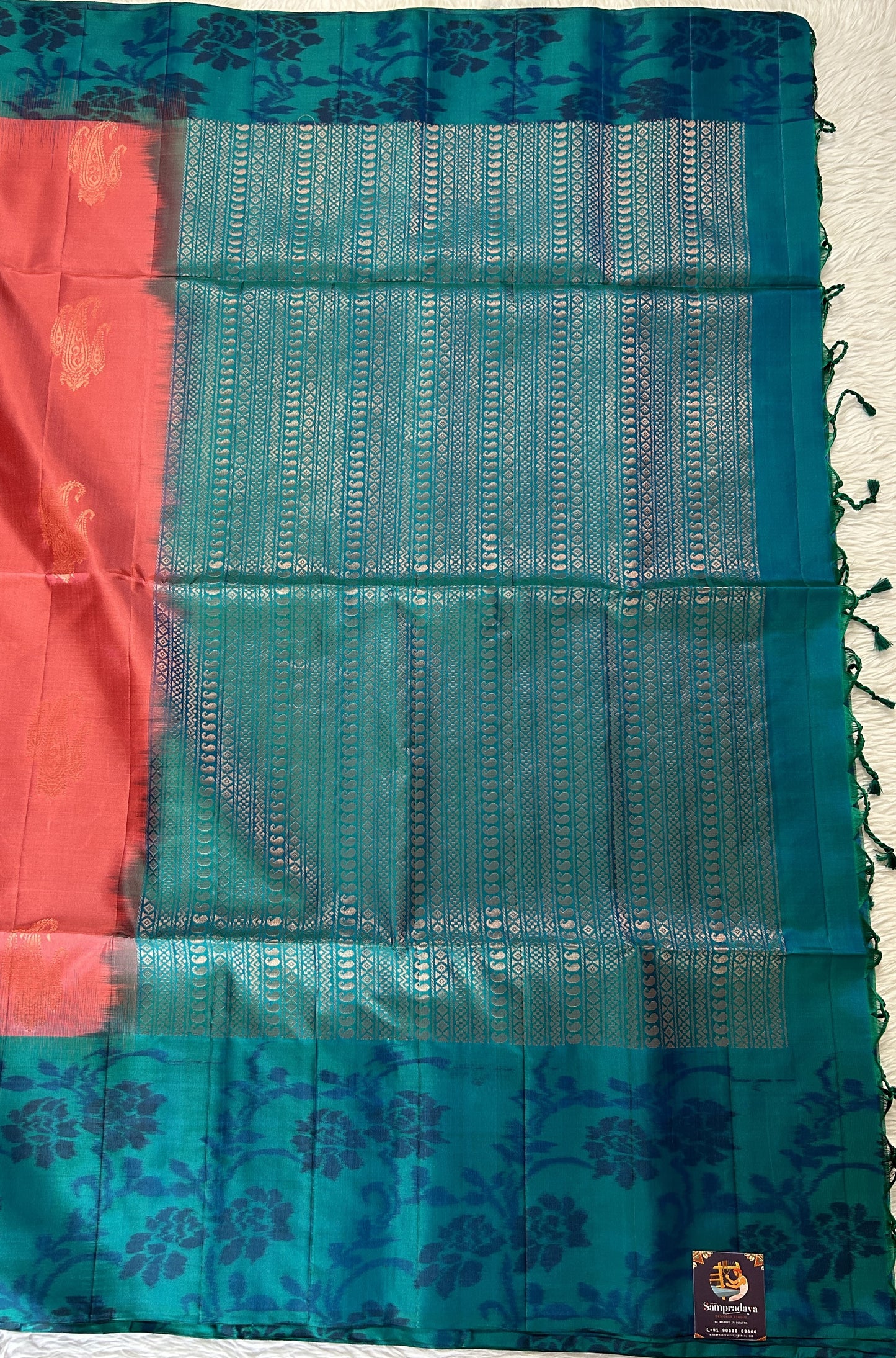 Kanjivaram Festive Soft Silk Saree Coral Pink colored Saree complemented with a Peacock Blue Colored Pochampally border. - Sampradaya Designer Studio