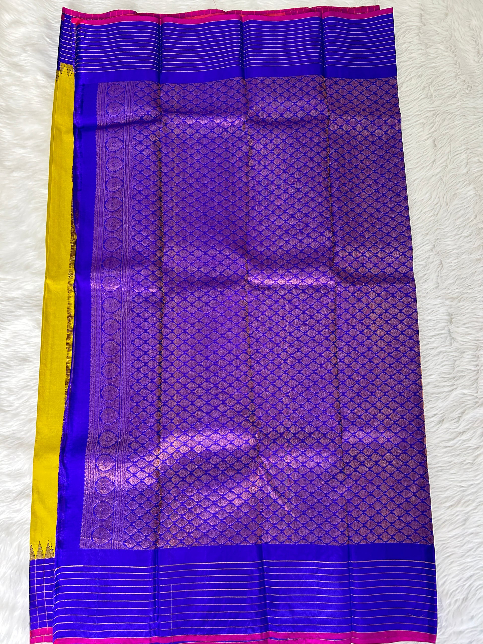 Gadwal Pattu Saree Lemon Yellow colored saree complemented with a Royal Blue border - Sampradaya Designer Studio
