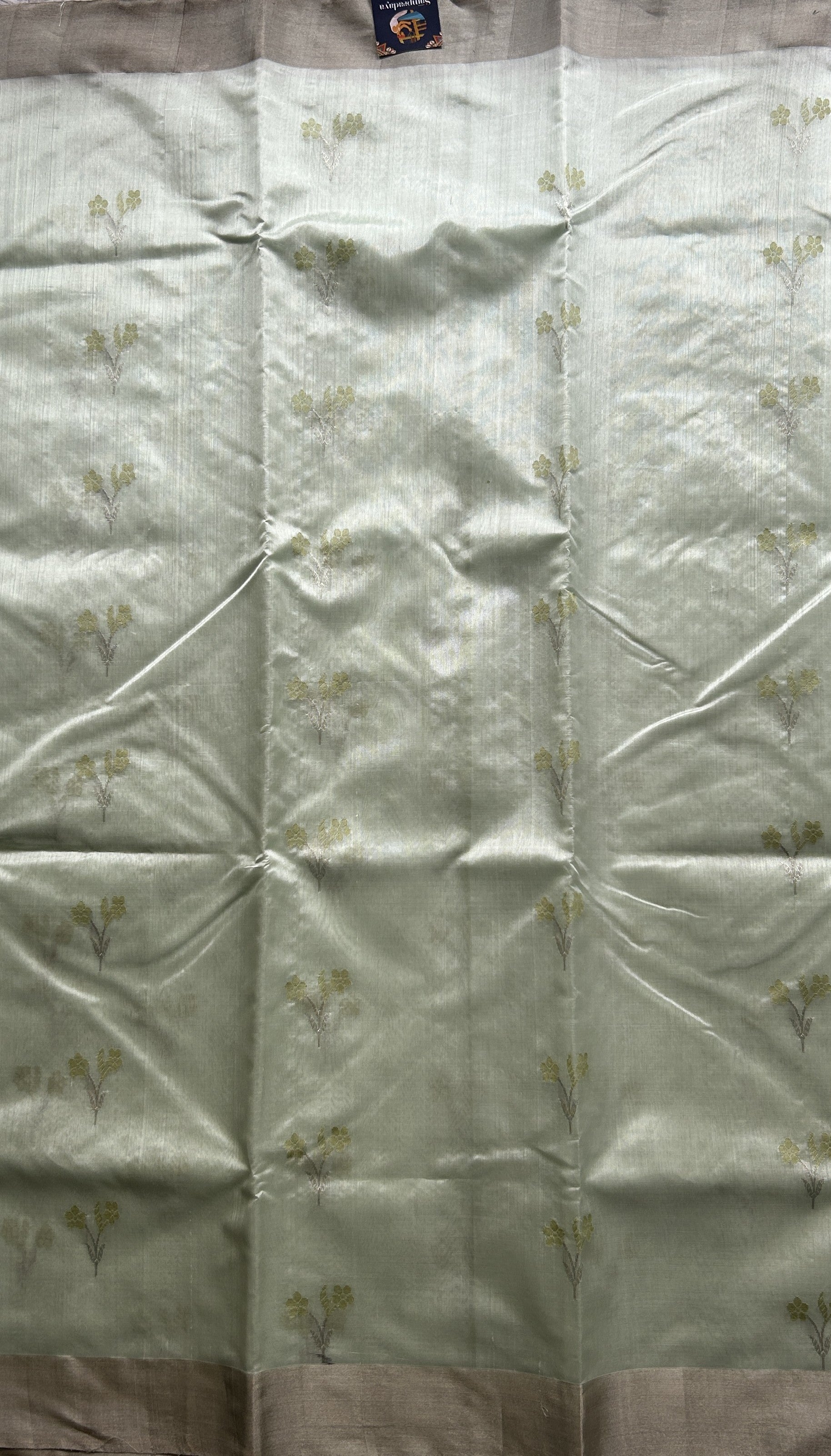 Chanderi Silk Saree Light Mint Green color Elegantly Paired with a Silver Zari border - Sampradaya Designer Studio