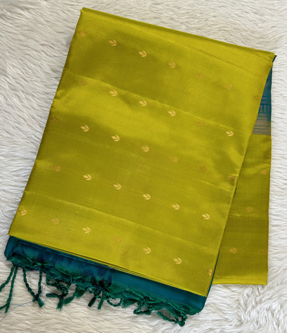 Kanjivaram Festive Soft Silk Saree Green colored Saree complemented with a Peacock Green Pochampally border. - Sampradaya Designer Studio