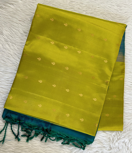 Kanjivaram Festive Soft Silk Saree Green colored Saree complemented with a Peacock Green Pochampally border. - Sampradaya Designer Studio