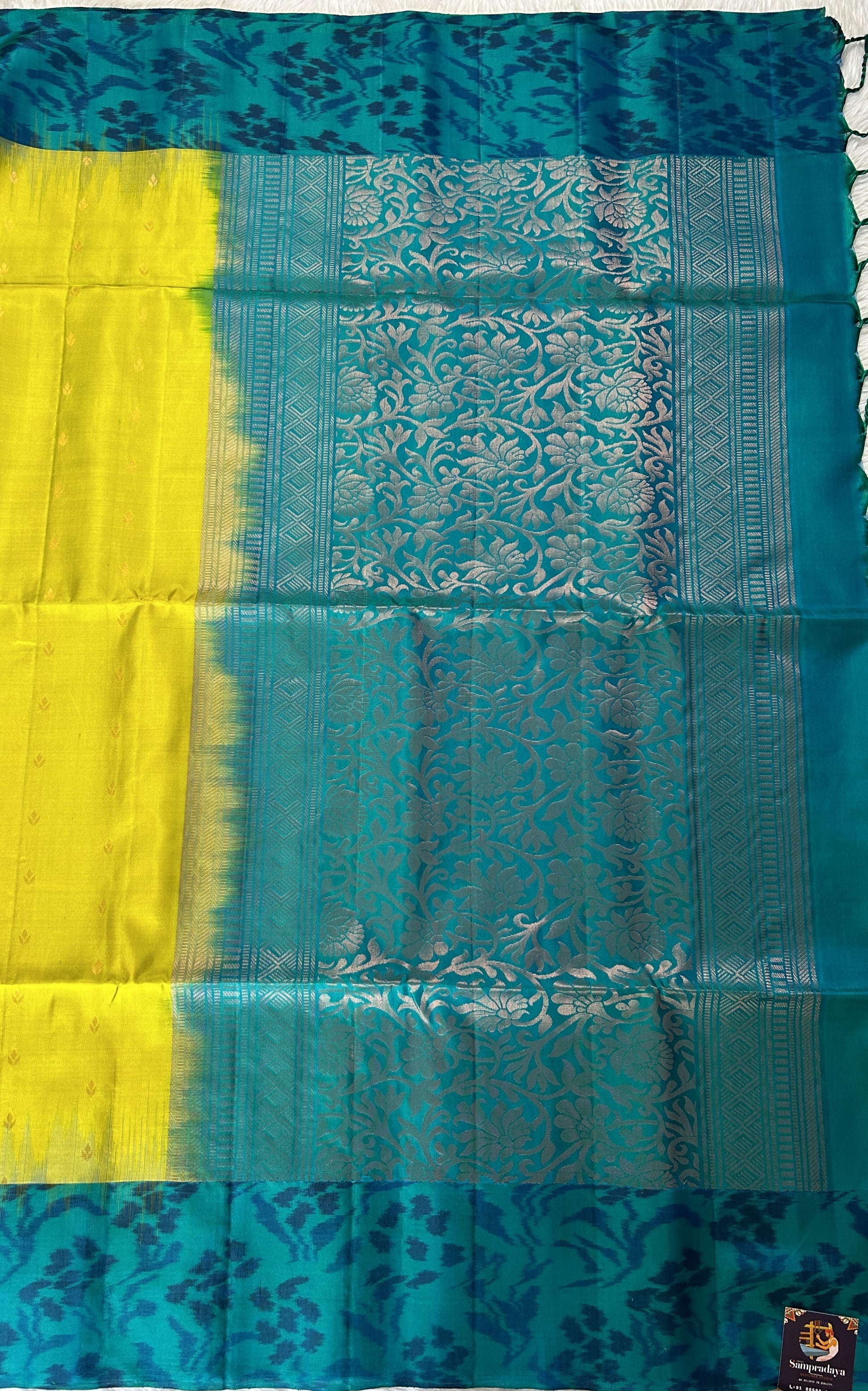 Kanjivaram Festive Soft Silk Saree Green colored Saree complemented with a Peacock Green Pochampally border. - Sampradaya Designer Studio