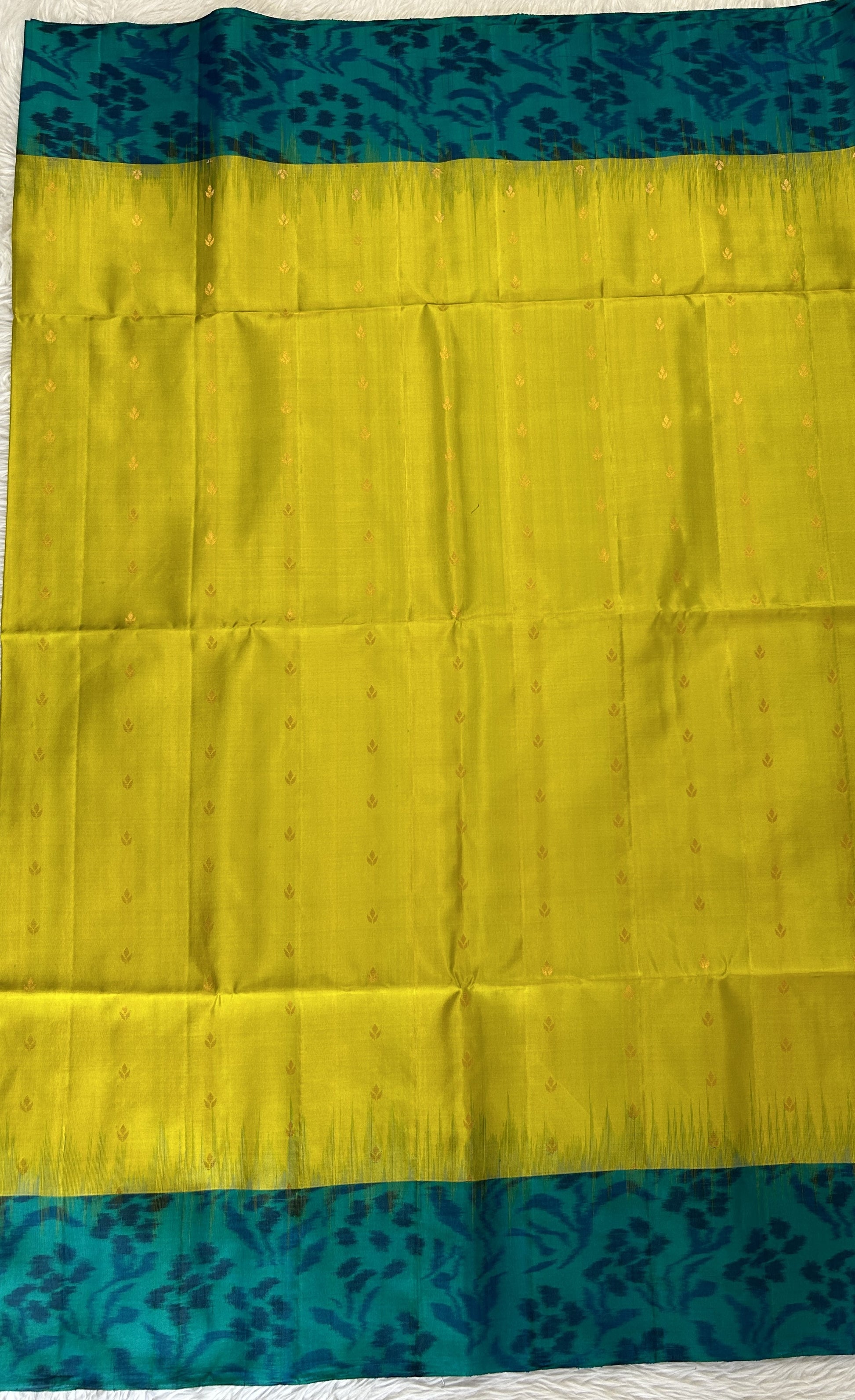 Kanjivaram Festive Soft Silk Saree Green colored Saree complemented with a Peacock Green Pochampally border. - Sampradaya Designer Studio
