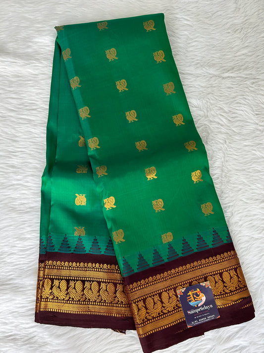 Gadwal Pattu Saree Bottle Green colored saree complemented with a Brown Kanchi border - Sampradaya Designer Studio