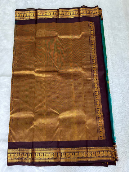 Gadwal Pattu Saree Bottle Green colored saree complemented with a Brown Kanchi border - Sampradaya Designer Studio