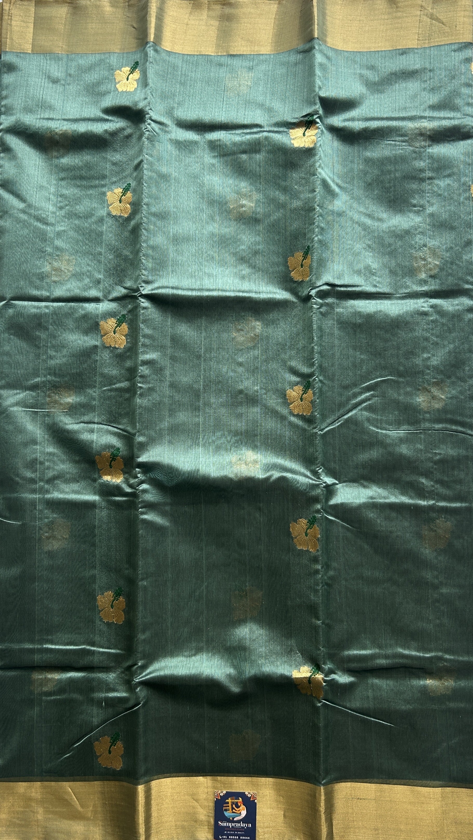 Chanderi Silk Saree Greyish Green color Elegantly Paired with a Gold Zari border - Sampradaya Designer Studio