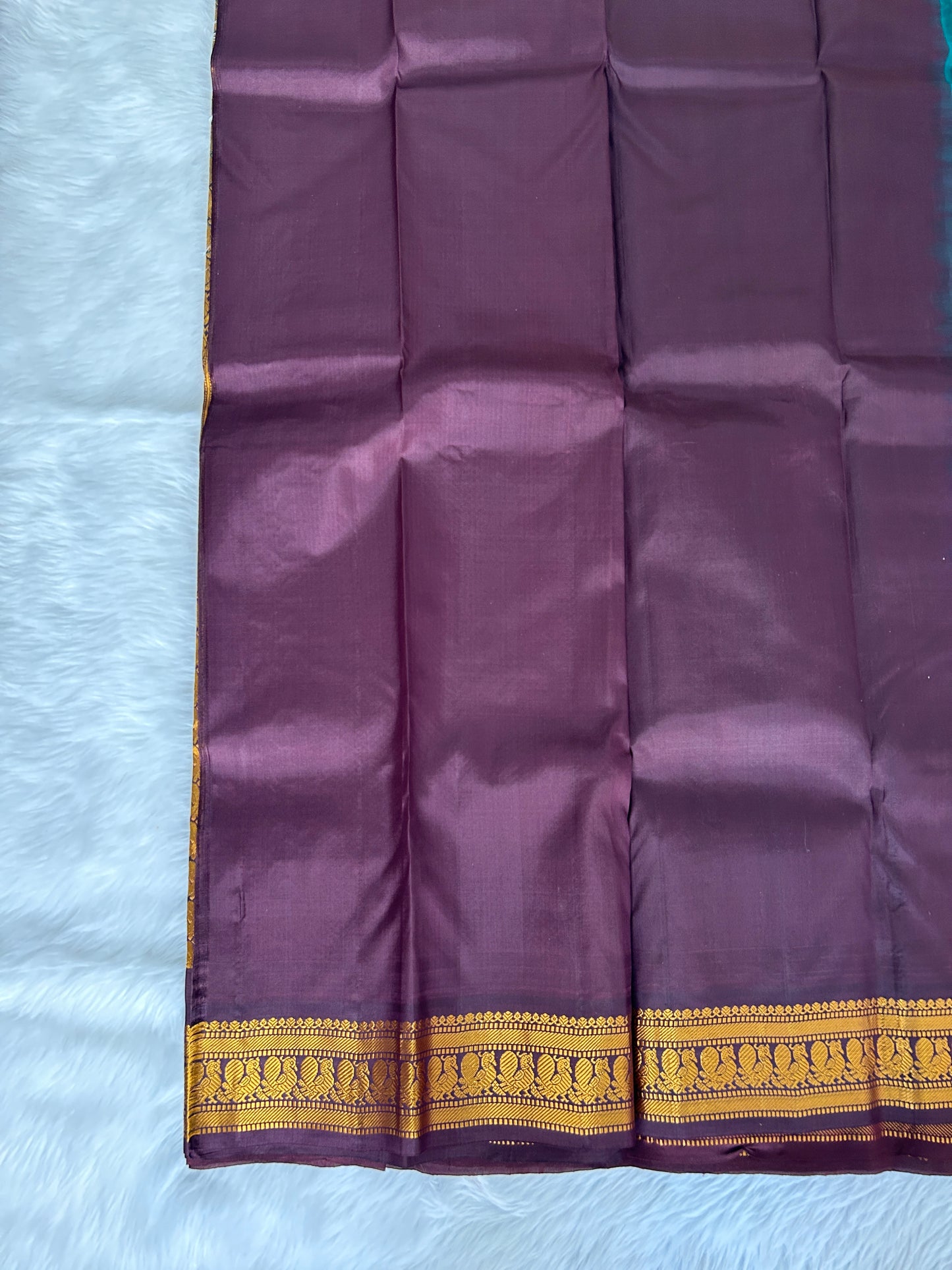 Gadwal Pattu Saree Bottle Green colored saree complemented with a Brown Kanchi border - Sampradaya Designer Studio