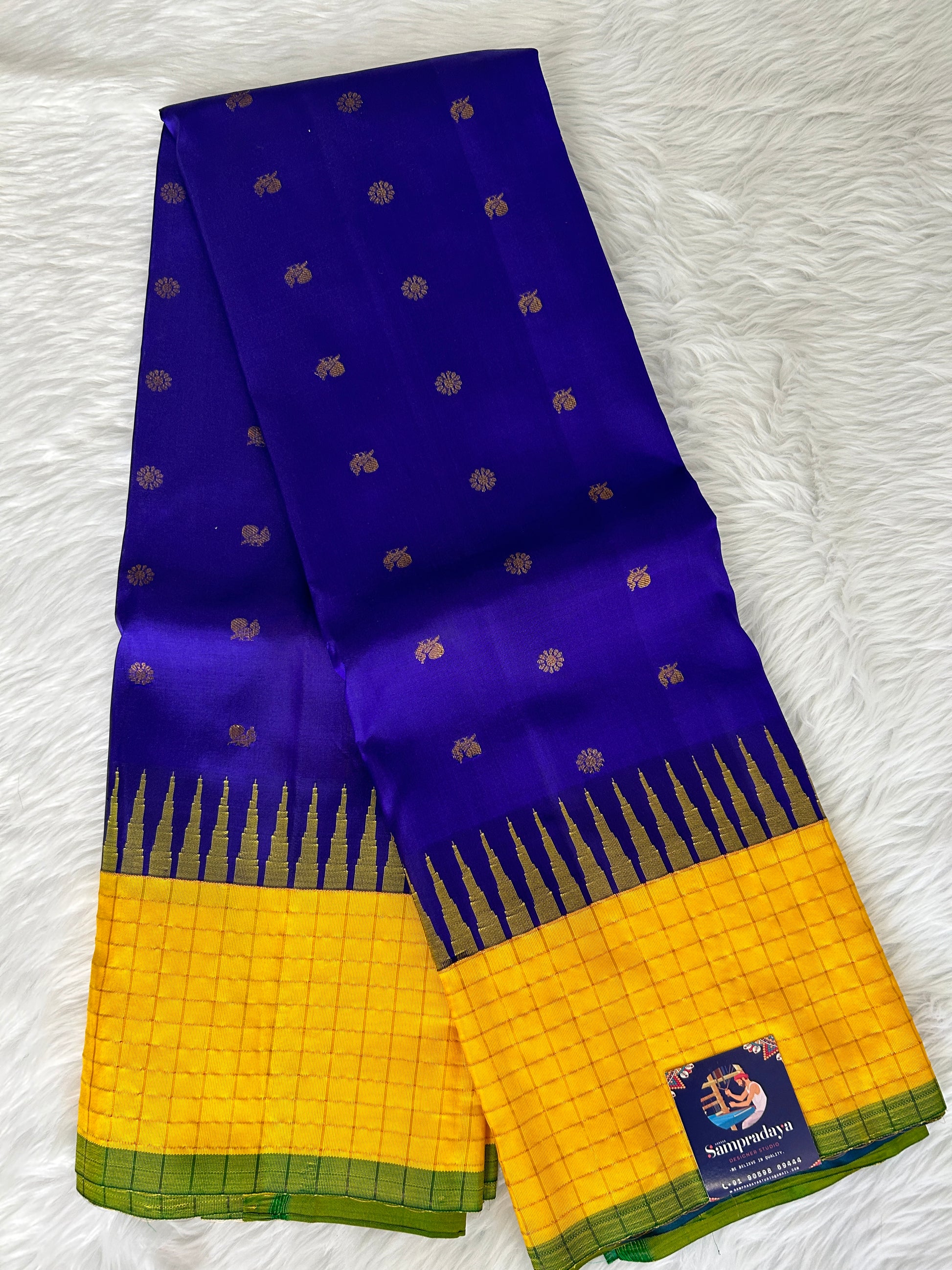 Gadwal Pattu Saree Dark Royal Blue colored saree complemented with a Yellow checks border - Sampradaya Designer Studio