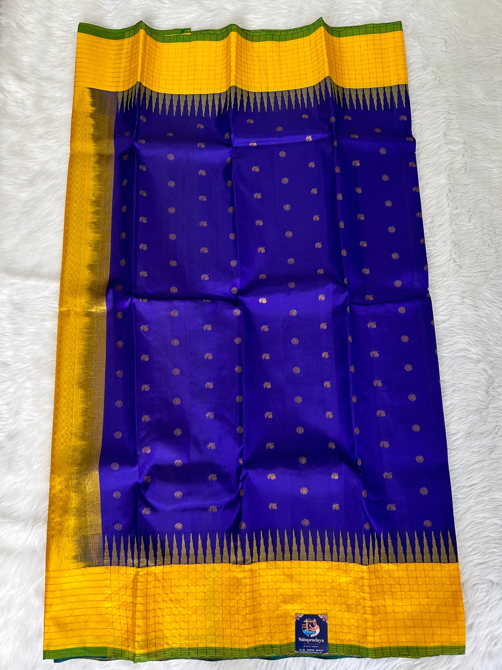 Gadwal Pattu Saree Dark Royal Blue colored saree complemented with a Yellow checks border - Sampradaya Designer Studio