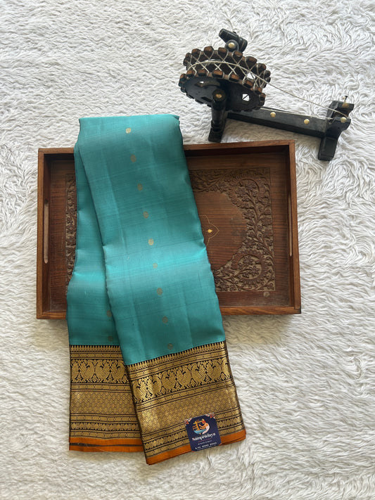 Pure Kanjivaram Silk Saree Greyish Blue Colored Complemented with Navy Blue Color Border with a Gold Zari Weaving. - Sampradaya Designer Studio