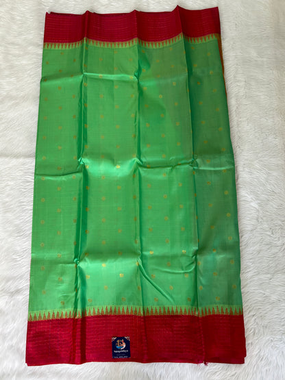 Gadwal Pattu Saree Sea Green colored saree complemented with a Pink checks border - Sampradaya Designer Studio