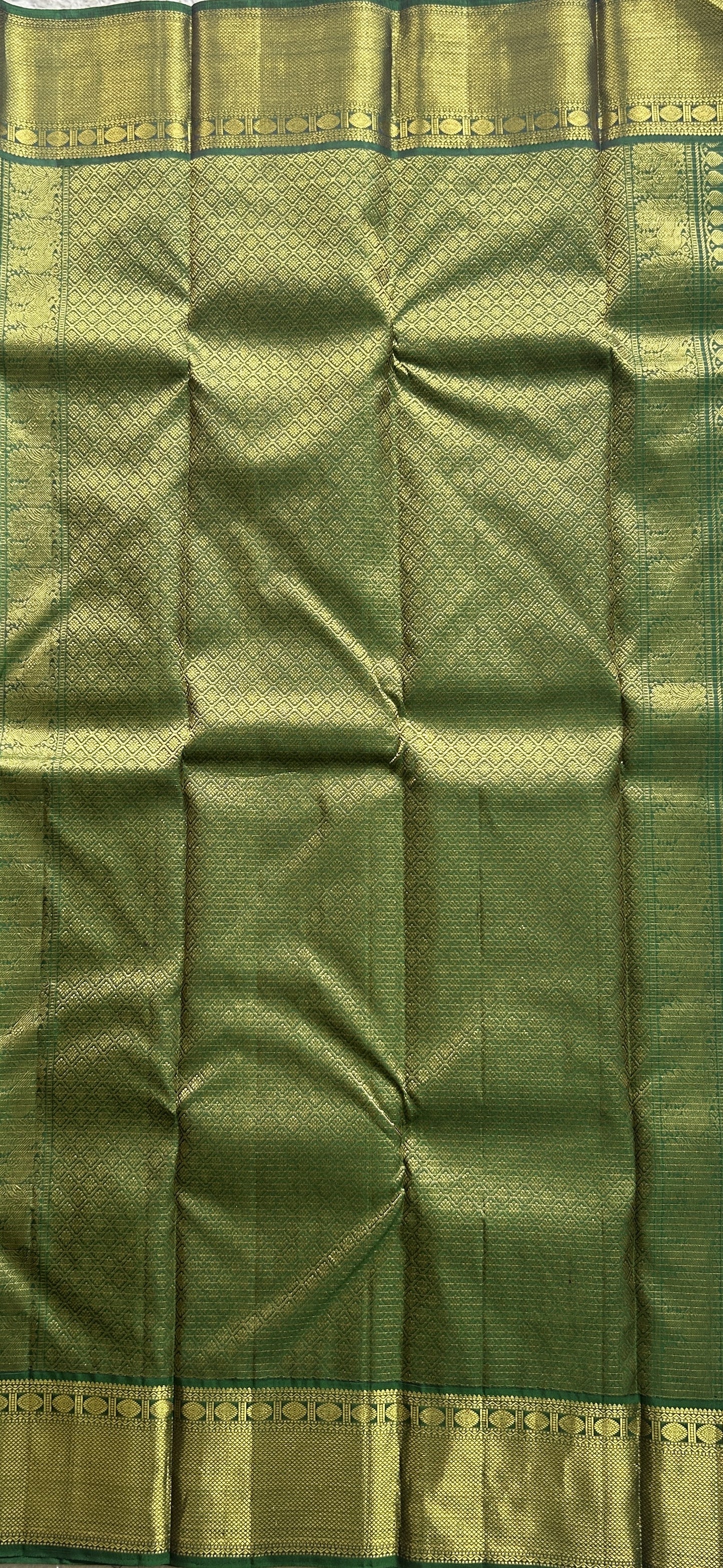 Pure Kanjivaram Silk Saree Dark Green Colored Complemented with a Gold Zari  Border. - Sampradaya Designer Studio