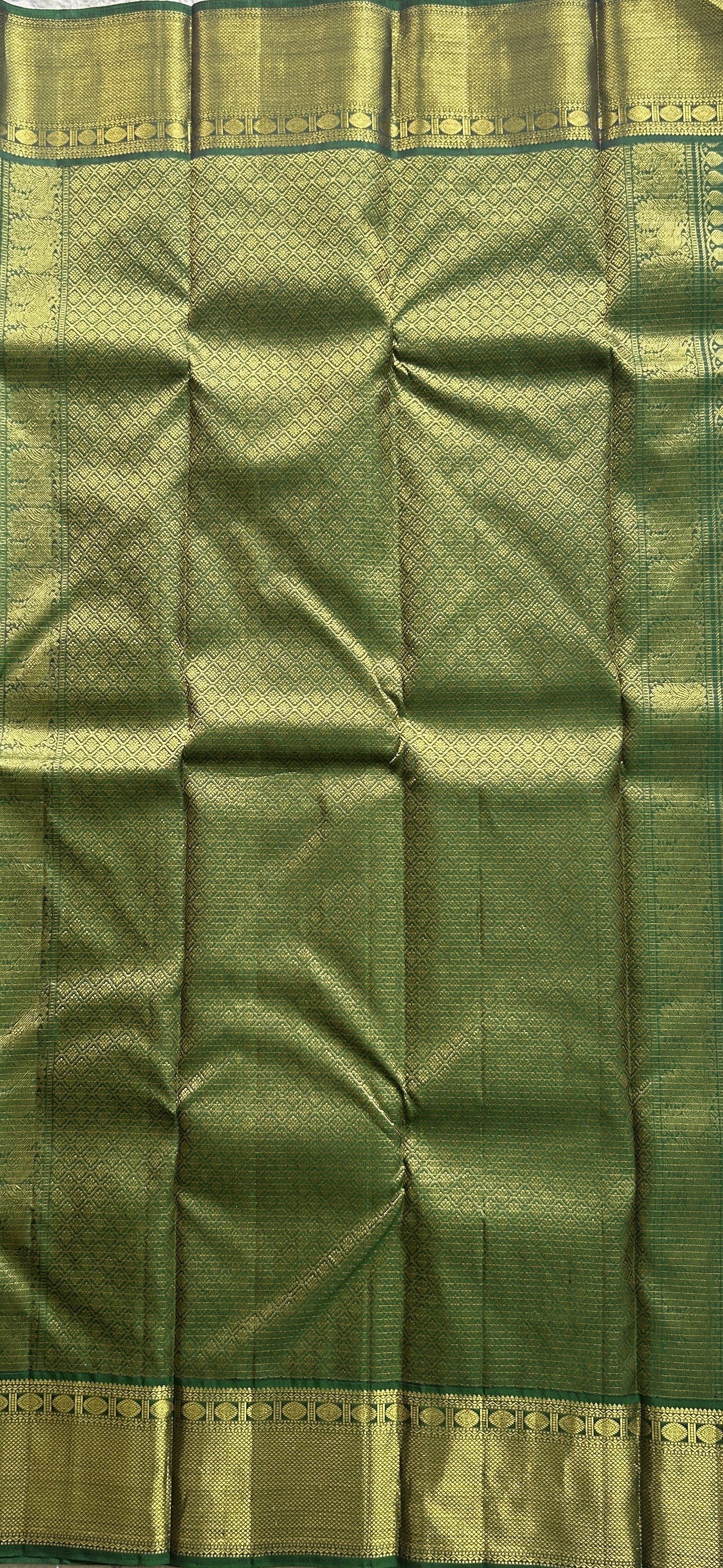 Pure Kanjivaram Silk Saree Dark Green Colored Complemented with a Gold Zari  Border. - Sampradaya Designer Studio