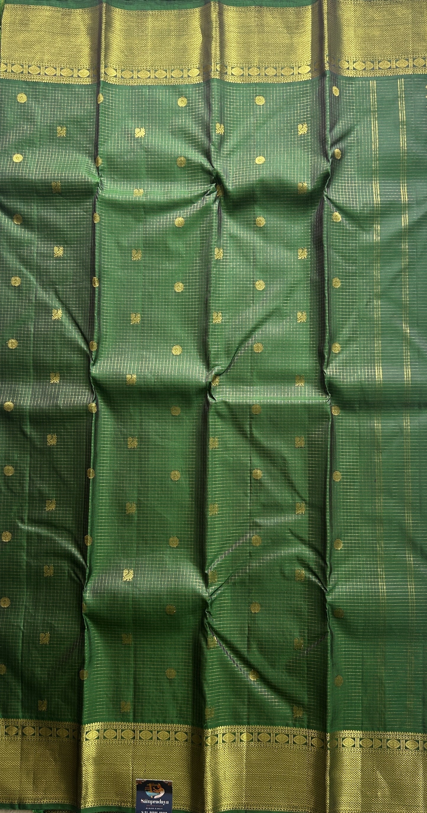 Pure Kanjivaram Silk Saree Dark Green Colored Complemented with a Gold Zari  Border. - Sampradaya Designer Studio