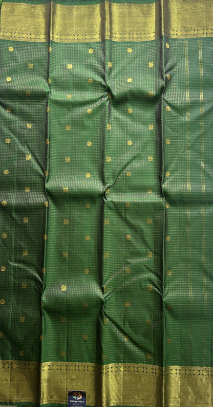 Pure Kanjivaram Silk Saree Dark Green Colored Complemented with a Gold Zari  Border. - Sampradaya Designer Studio