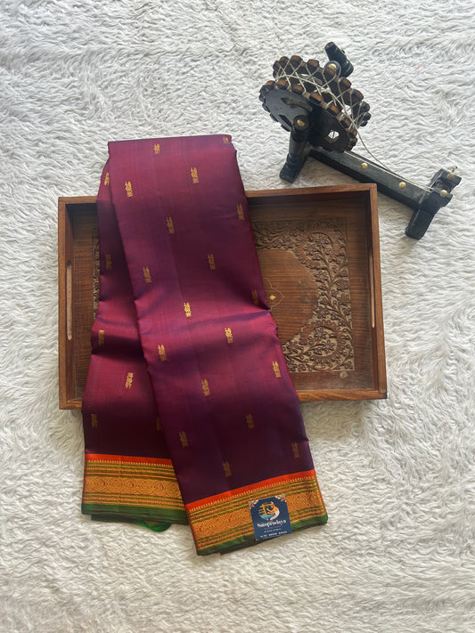 Pure Kanjivaram Silk Saree Purple Colored Complemented with Orange Color Border with a Gold Zari Weaving. - Sampradaya Designer Studio