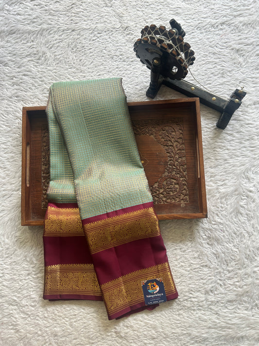 Pure Kanjivaram Silk Saree Greyish Blue Colored Complemented with Wine Color Gap Border with a Gold Zari Weaving. - Sampradaya Designer Studio