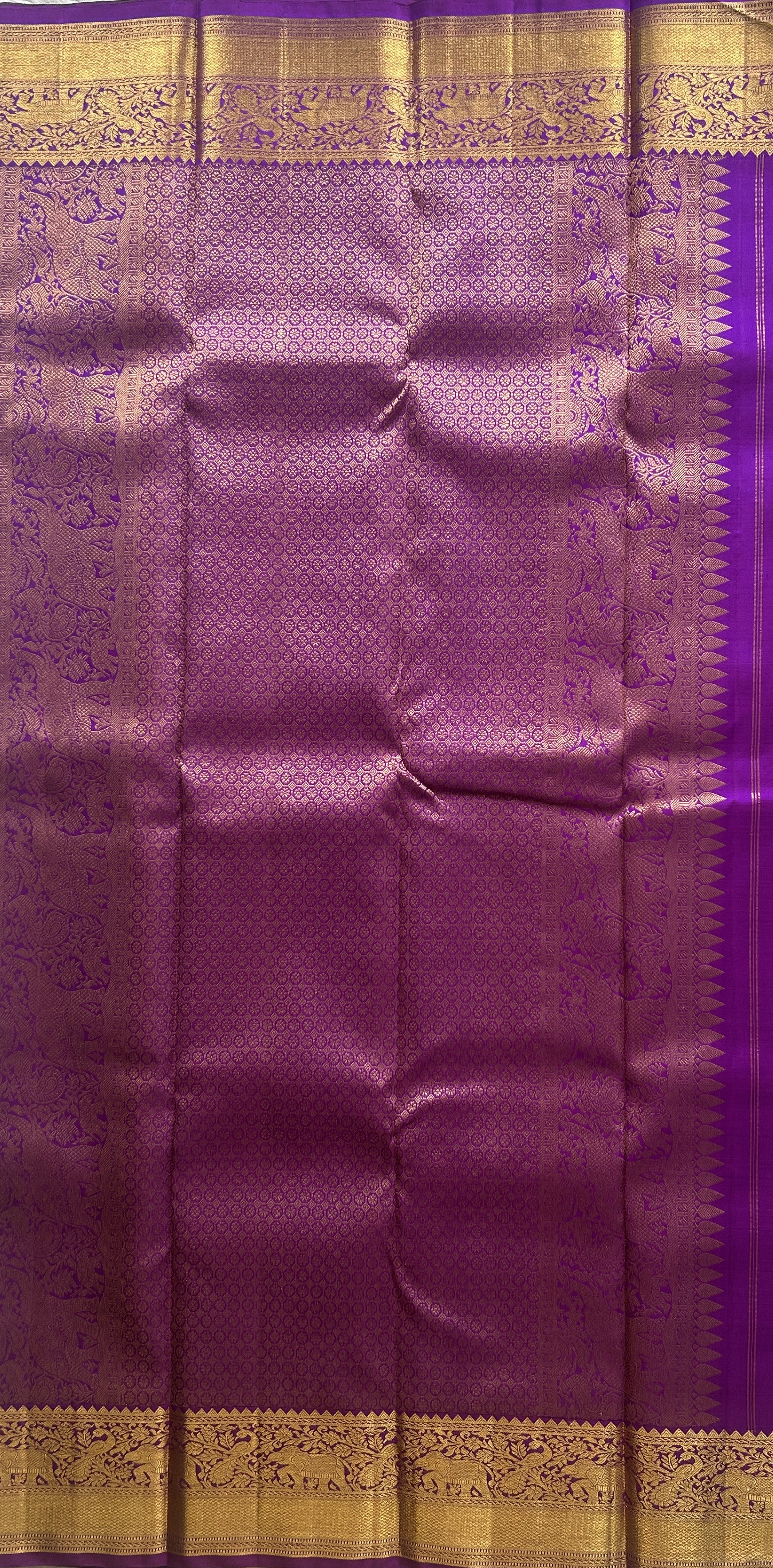 Pure Kanjivaram Silk Saree Purple Colored Complemented with a Gold Zari Gap Border. - Sampradaya Designer Studio
