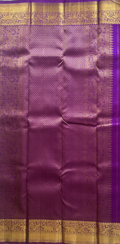 Pure Kanjivaram Silk Saree Purple Colored Complemented with a Gold Zari Gap Border. - Sampradaya Designer Studio