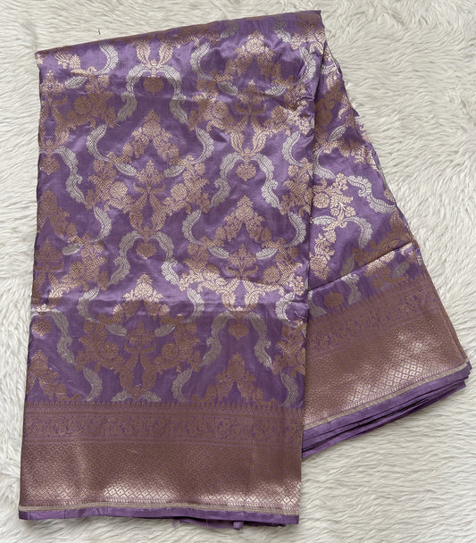 Banarasi Katan Silk Saree Lavender Colored Complemented with a Gold Zari border. - Sampradaya Designer Studio