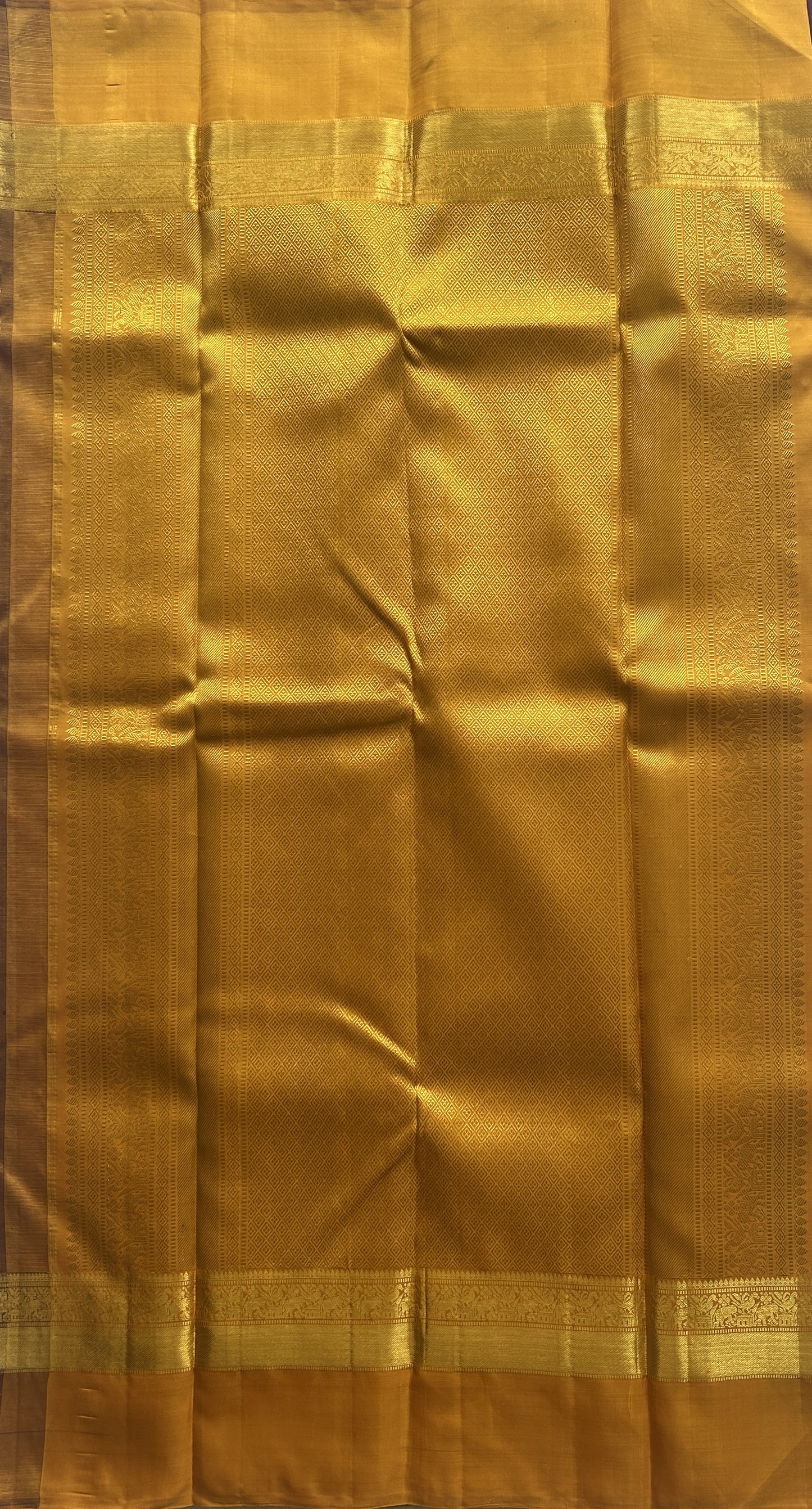 Pure Kanjivaram Silk Saree Wine Colored Complemented with a Gold Zari Gap Border. - Sampradaya Designer Studio