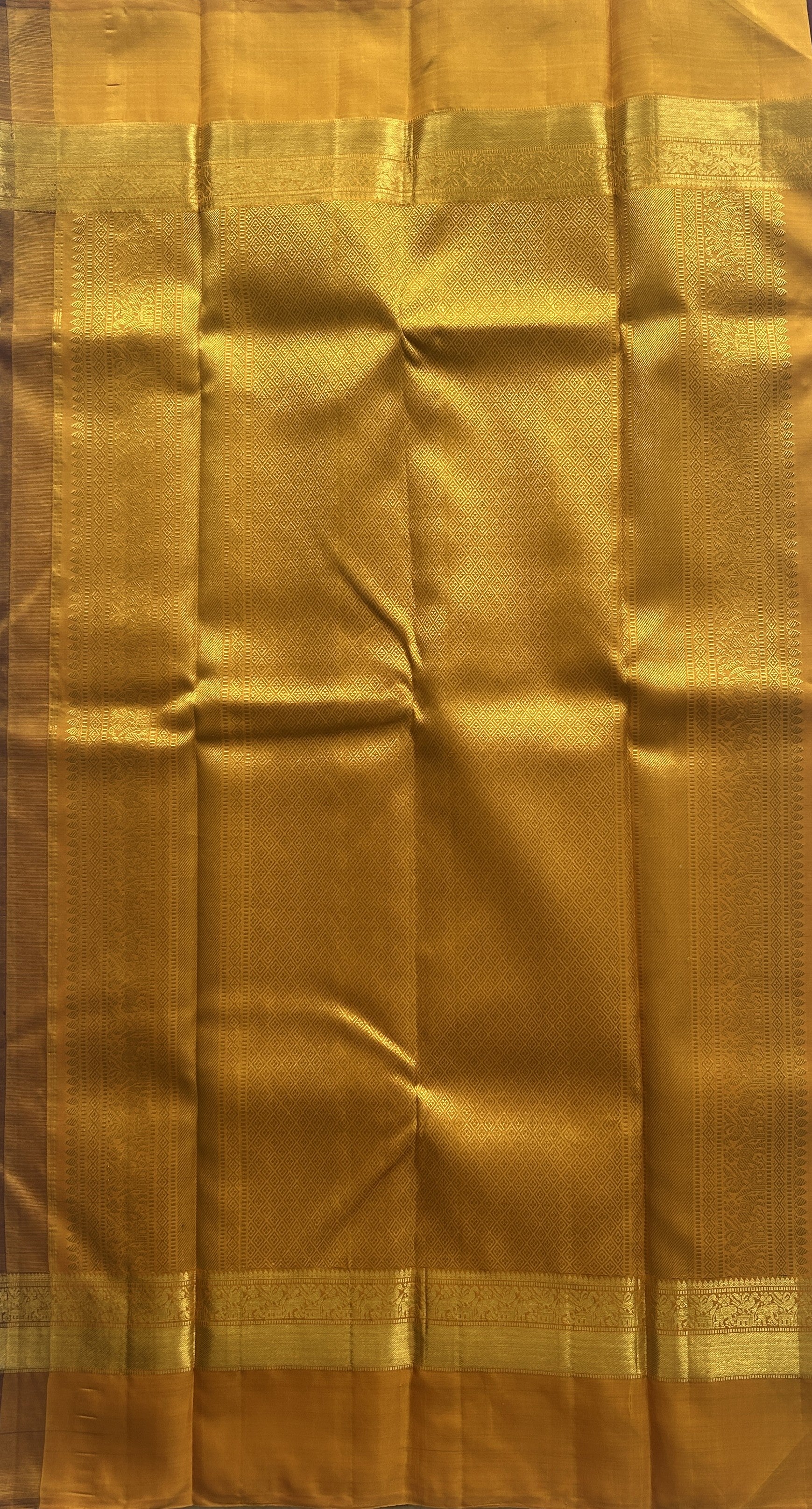 Pure Kanjivaram Silk Saree Wine Colored Complemented with a Gold Zari Gap Border. - Sampradaya Designer Studio