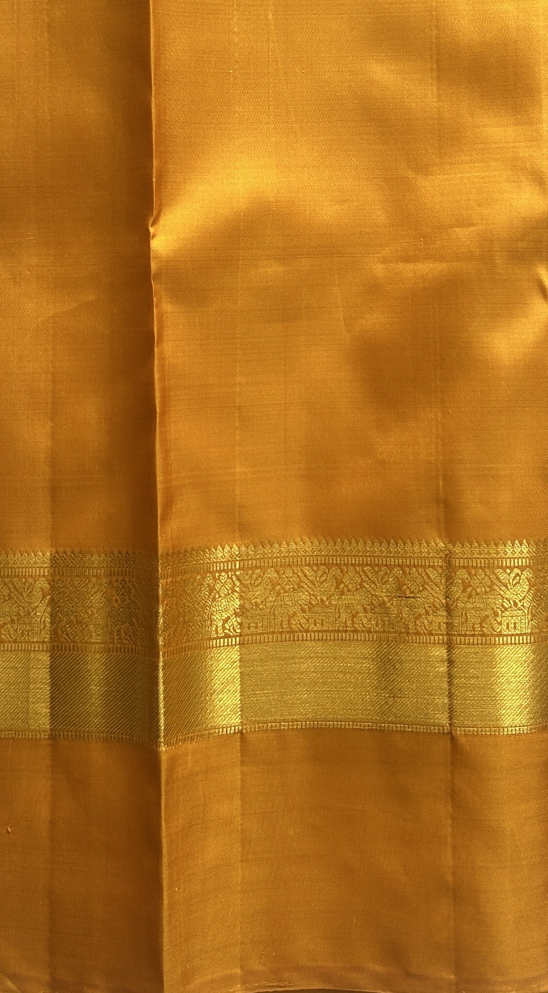 Pure Kanjivaram Silk Saree Wine Colored Complemented with a Gold Zari Gap Border. - Sampradaya Designer Studio