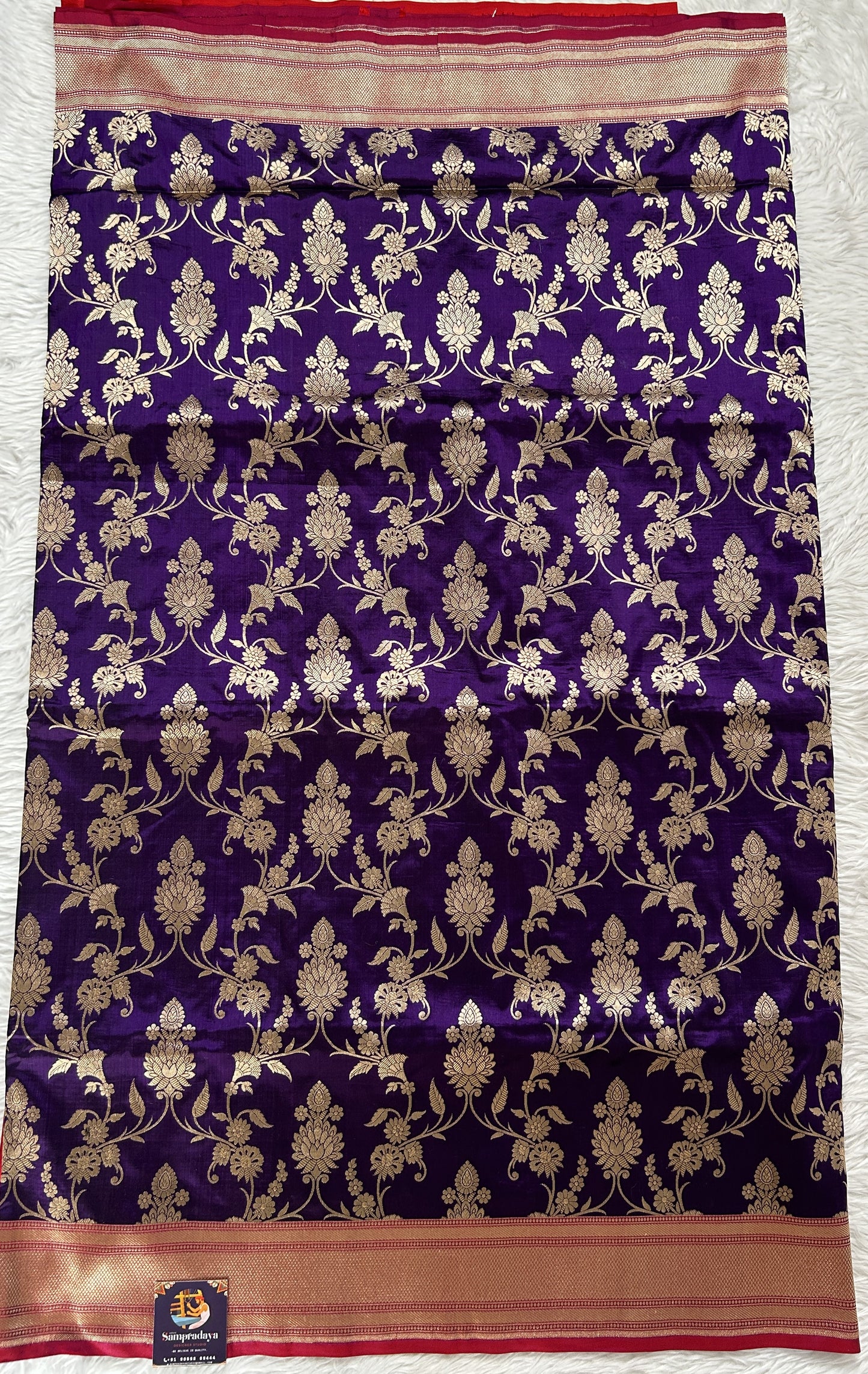 Banarasi Katan Silk Saree Violet Colored Complemented with a Gold Zari border. - Sampradaya Designer Studio