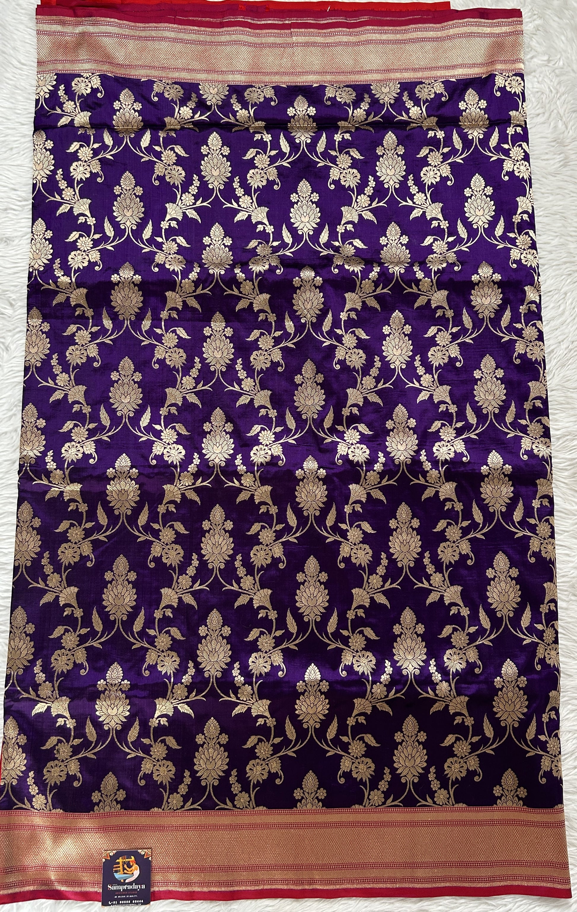 Banarasi Katan Silk Saree Violet Colored Complemented with a Gold Zari border. - Sampradaya Designer Studio