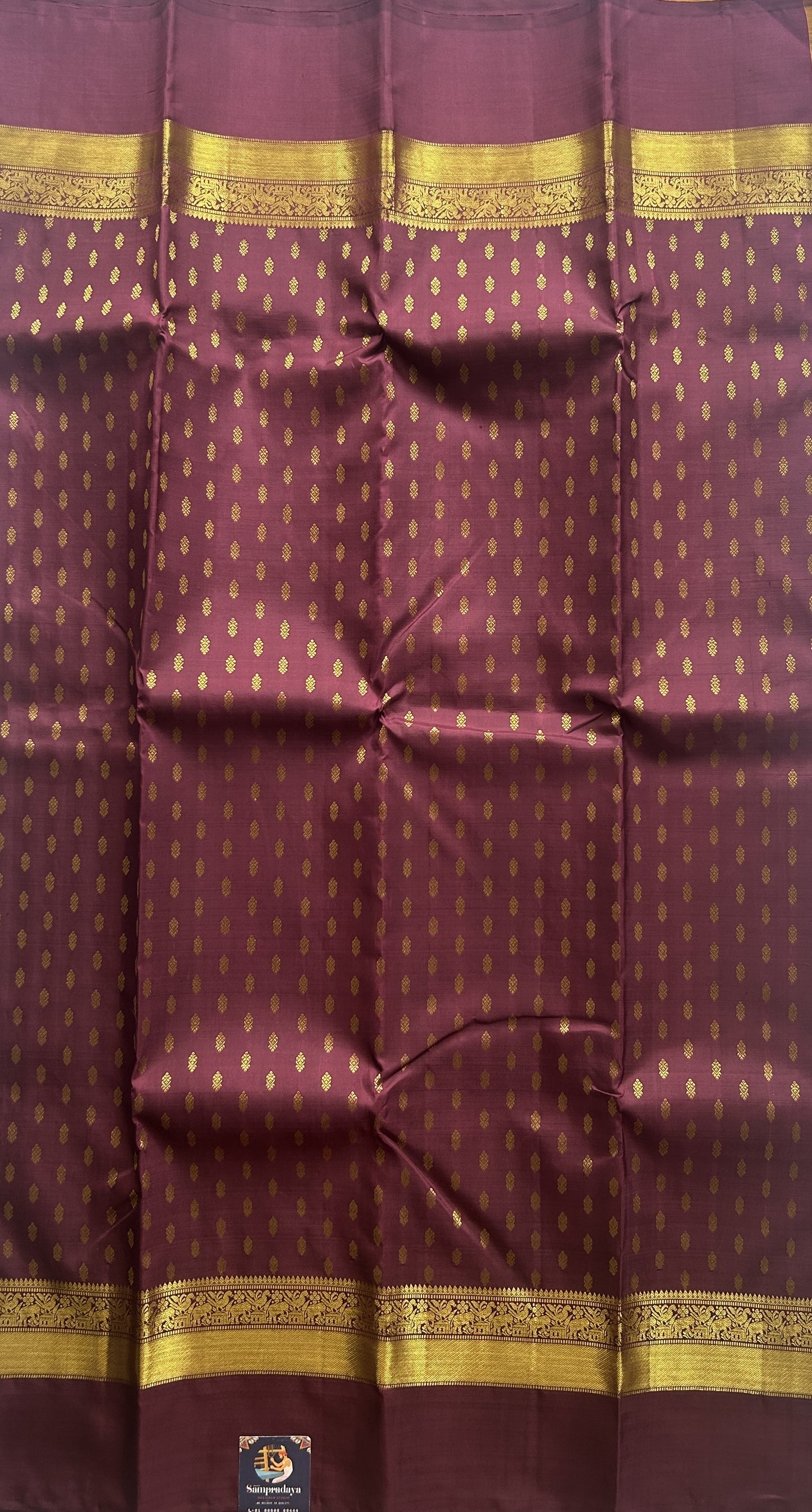 Pure Kanjivaram Silk Saree Wine Colored Complemented with a Gold Zari Gap Border. - Sampradaya Designer Studio