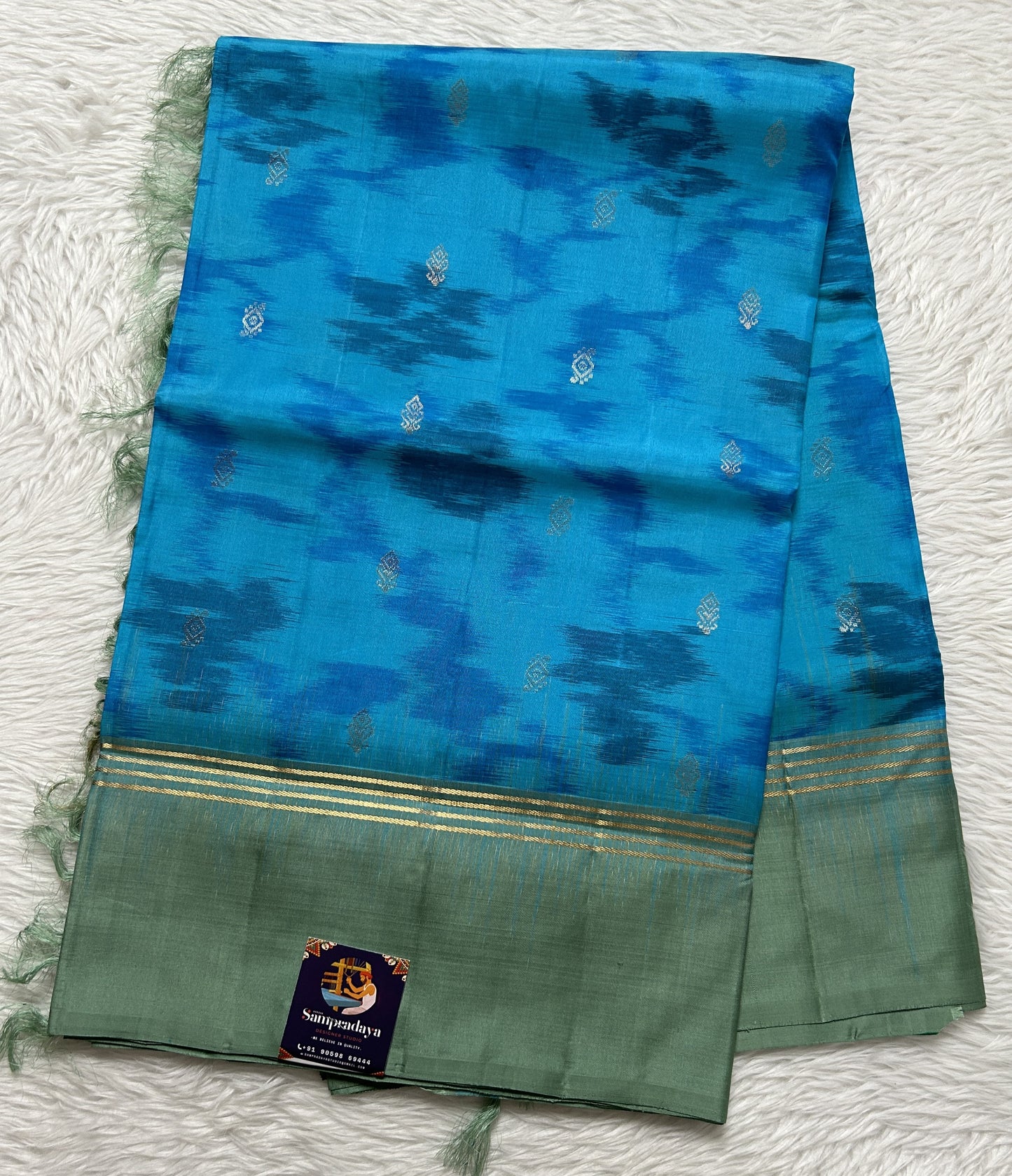 Kanjivaram Festive Soft Silk Saree Blue colored complemented with a Olive Green Colored Plain border. - Sampradaya Designer Studio