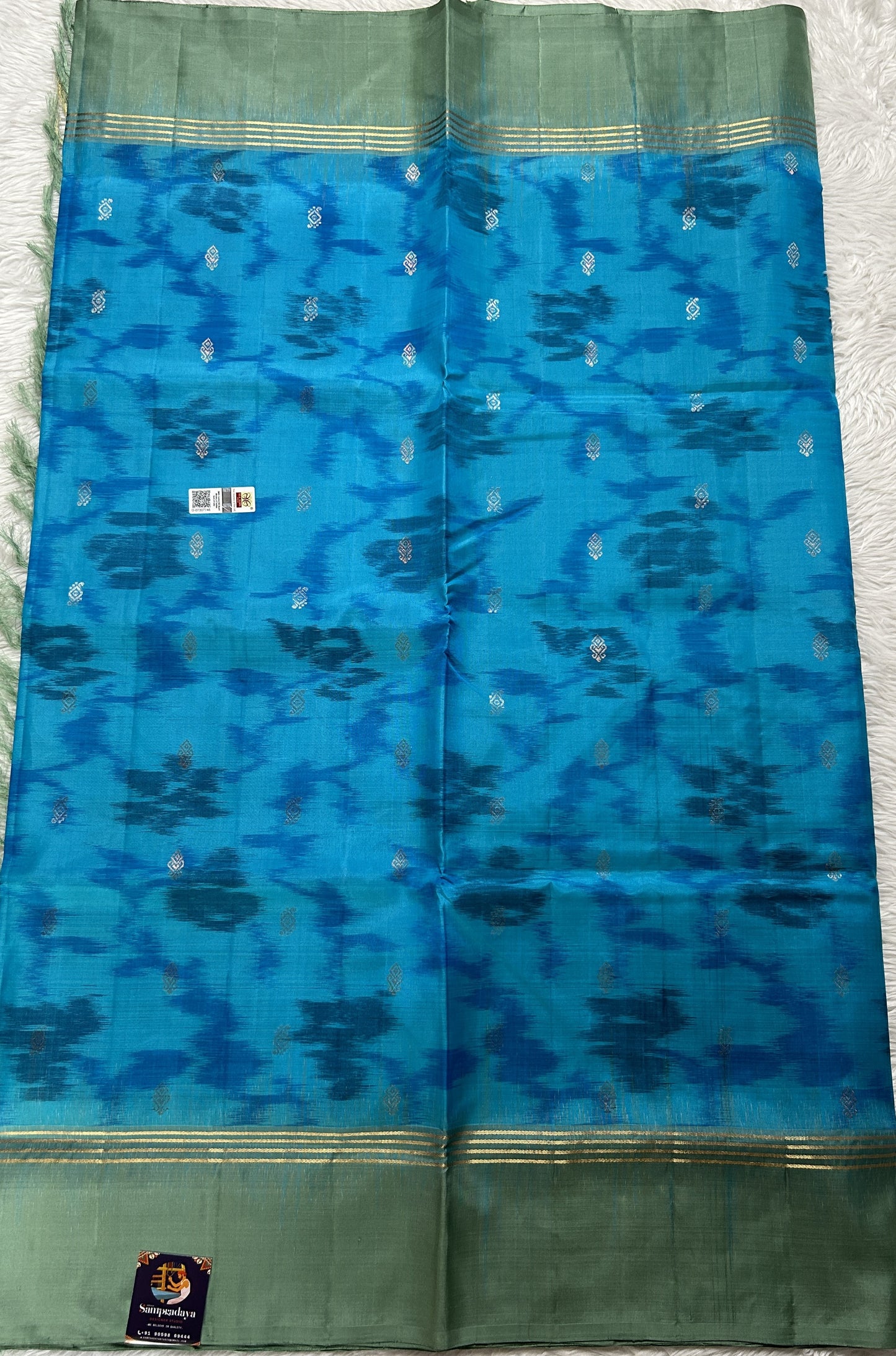 Kanjivaram Festive Soft Silk Saree Blue colored complemented with a Olive Green Colored Plain border. - Sampradaya Designer Studio