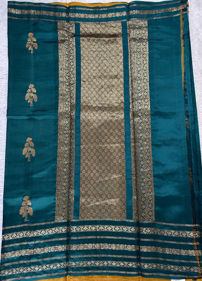 Raw Mango or Pooniya Silk Saree Bottle Green Colored Complemented With a Gap Border - Sampradaya Designer Studio