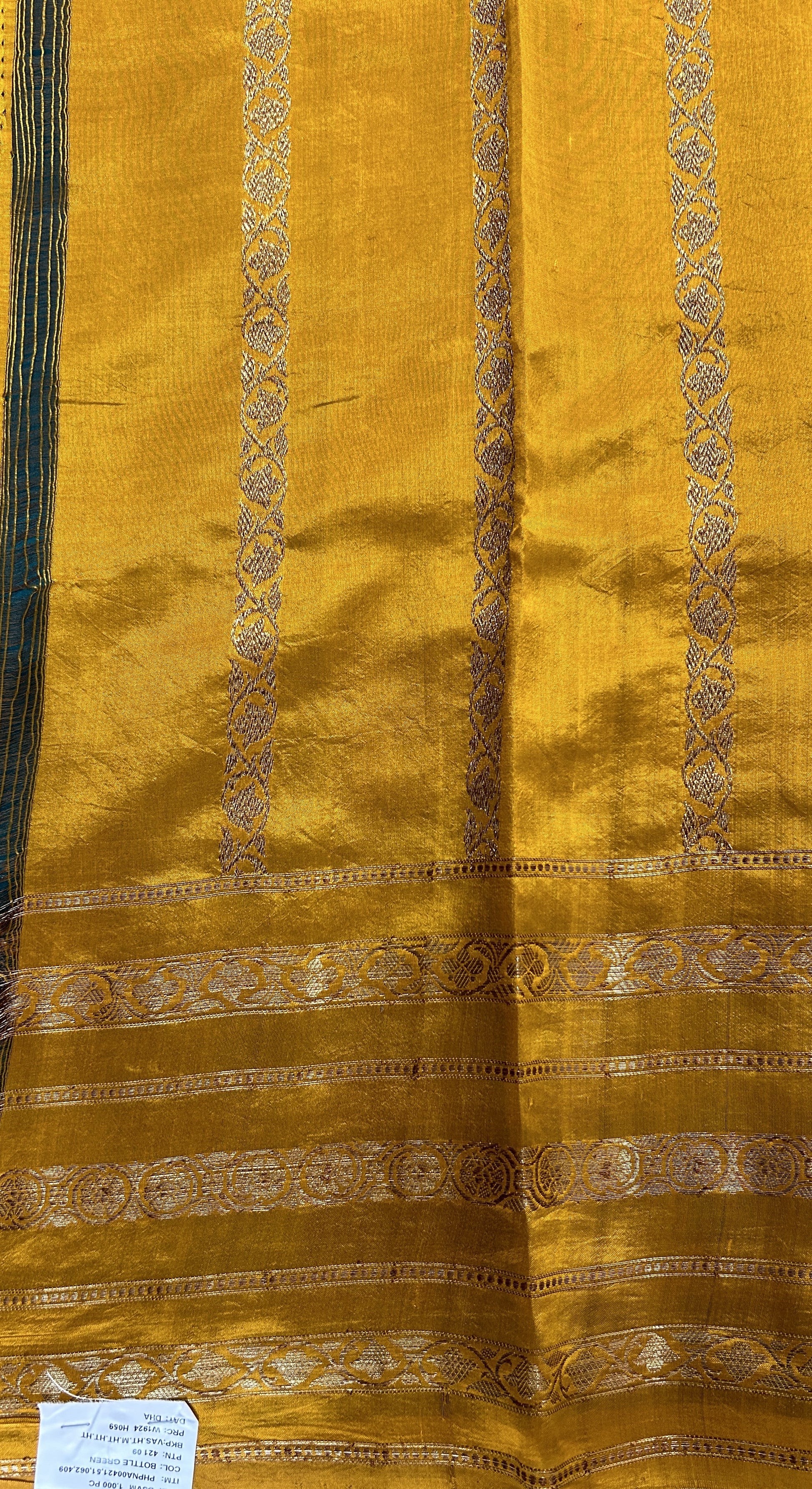 Raw Mango or Pooniya Silk Saree Bottle Green Colored Complemented With a Gap Border - Sampradaya Designer Studio