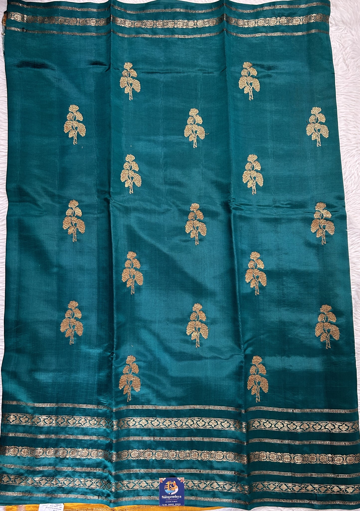 Raw Mango or Pooniya Silk Saree Bottle Green Colored Complemented With a Gap Border - Sampradaya Designer Studio