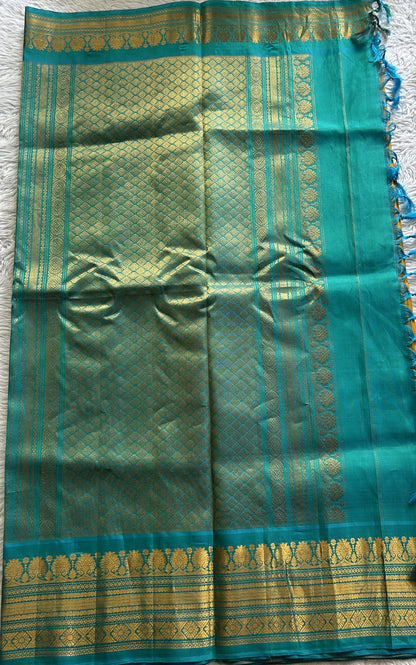 Gadwal Silk Saree Yellow Colored Complemented With a Sea Blue Color Zari Border - Sampradaya Designer Studio