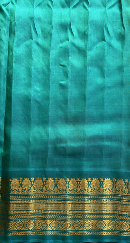 Gadwal Silk Saree Yellow Colored Complemented With a Sea Blue Color Zari Border - Sampradaya Designer Studio