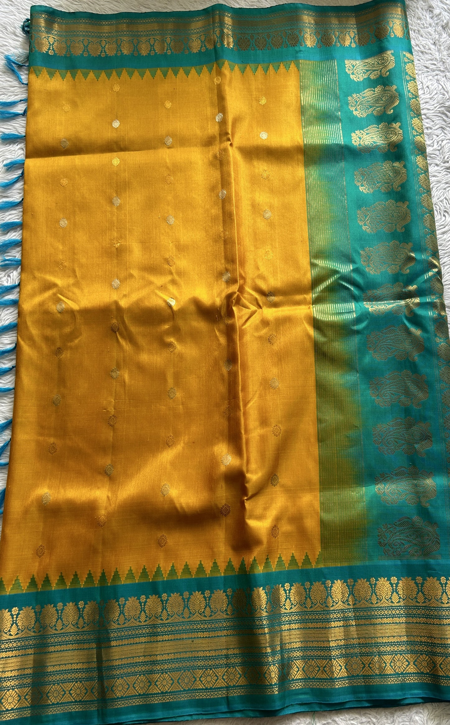 Gadwal Silk Saree Yellow Colored Complemented With a Sea Blue Color Zari Border - Sampradaya Designer Studio