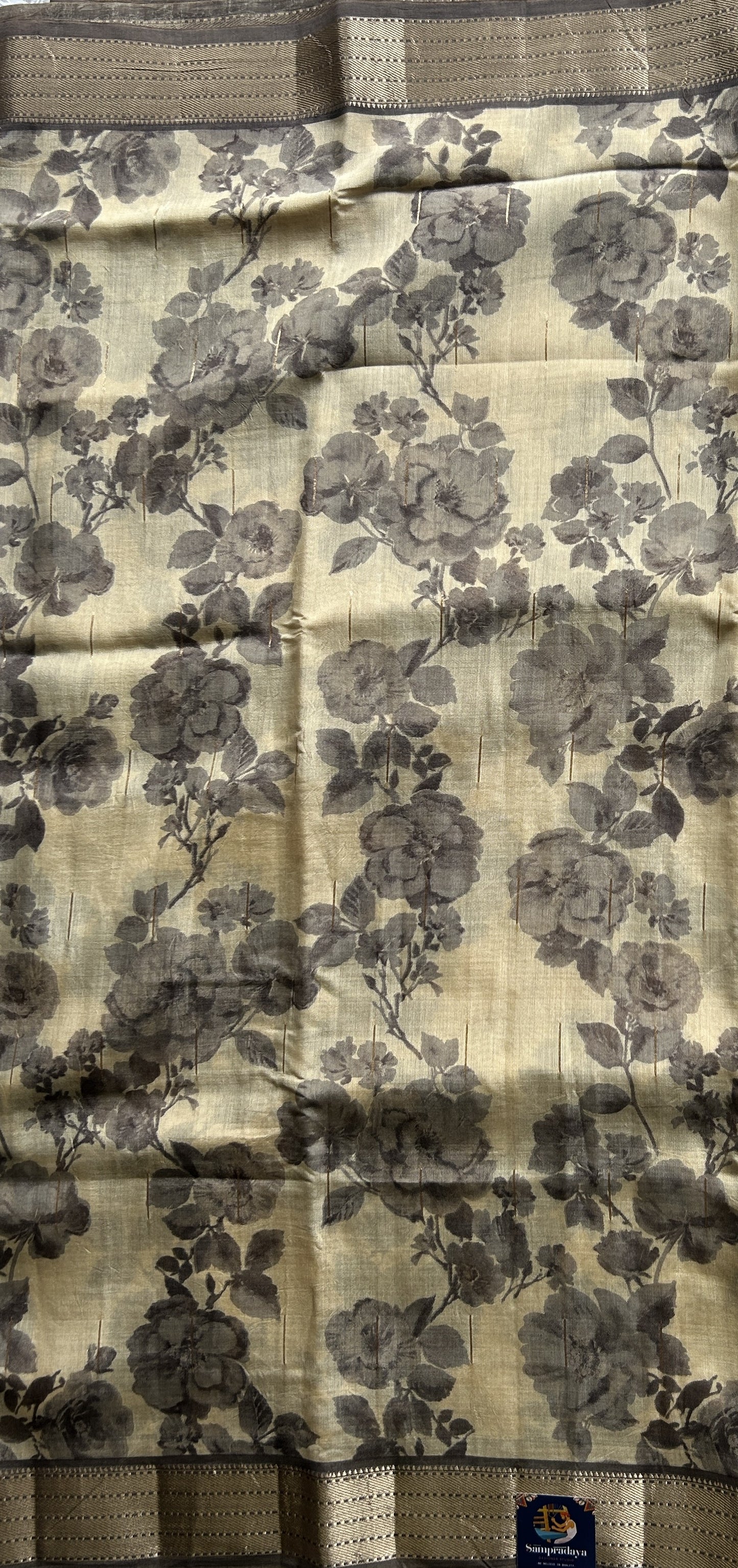 Dola Crepe Saree Beige Colored Elegantly Paired with a Gold Zari Border. - Sampradaya Designer Studio