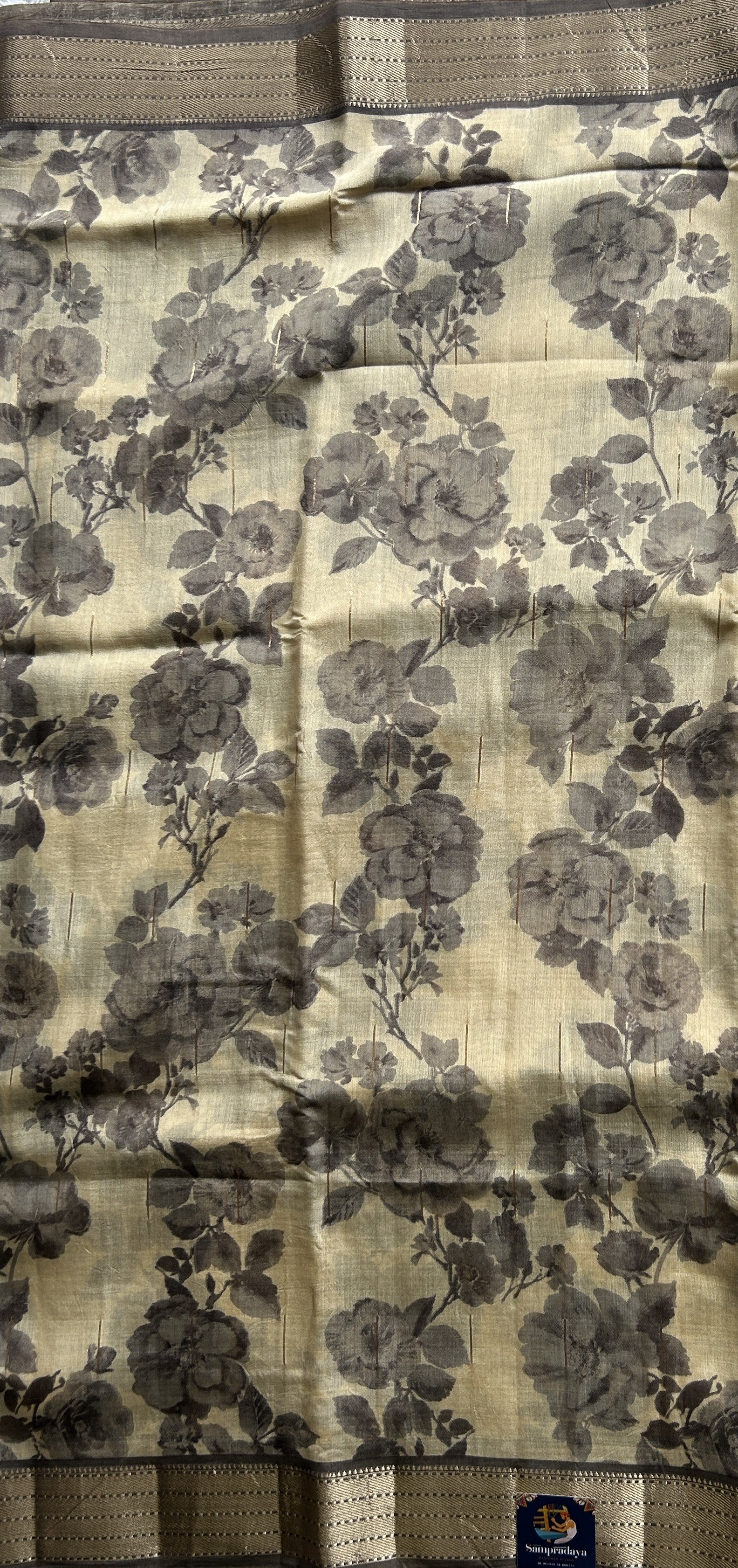 Dola Crepe Saree Beige Colored Elegantly Paired with a Gold Zari Border. - Sampradaya Designer Studio