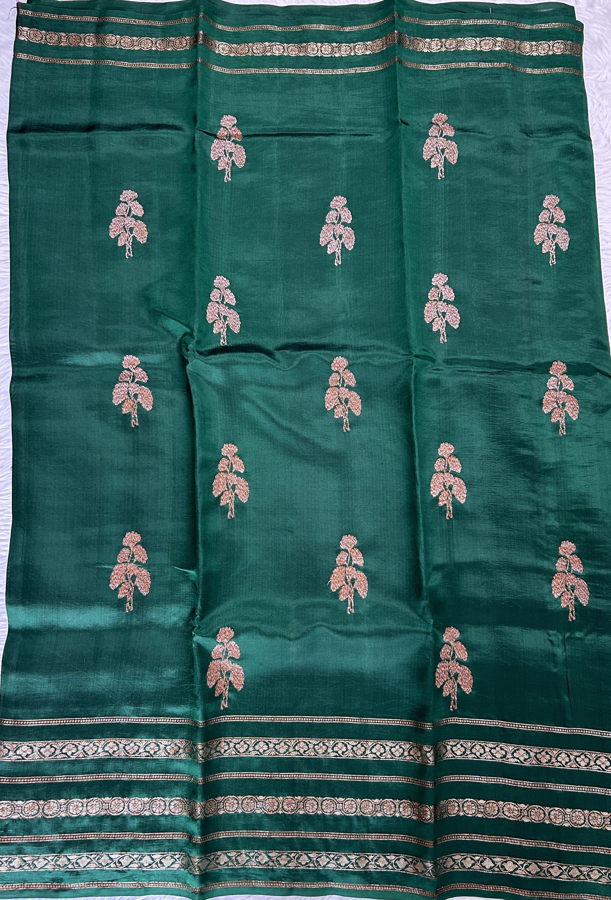 Raw Mango or Pooniya Silk Saree Bottle Green Colored Complemented With a Zari Gap Border - Sampradaya Designer Studio