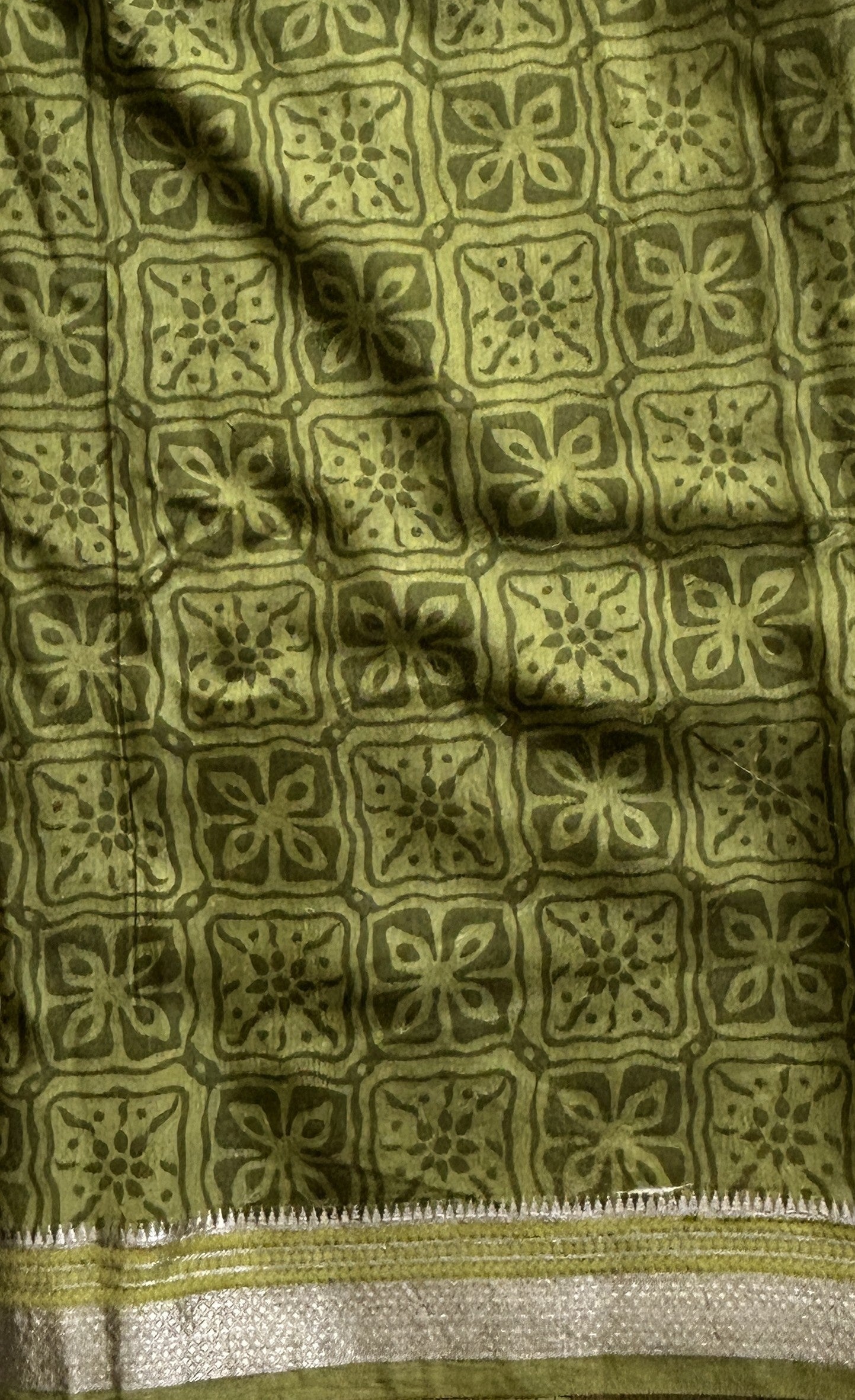 Dola Crepe Saree Leaf Green Colored Elegantly Paired with a Zari Border. - Sampradaya Designer Studio