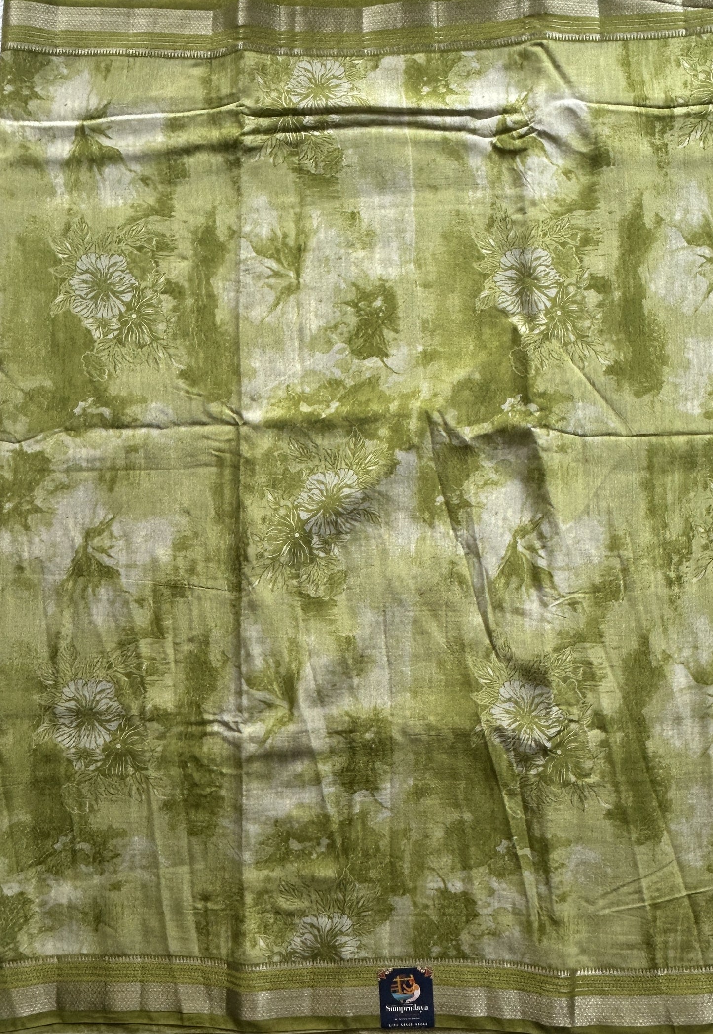 Dola Crepe Saree Leaf Green Colored Elegantly Paired with a Zari Border. - Sampradaya Designer Studio