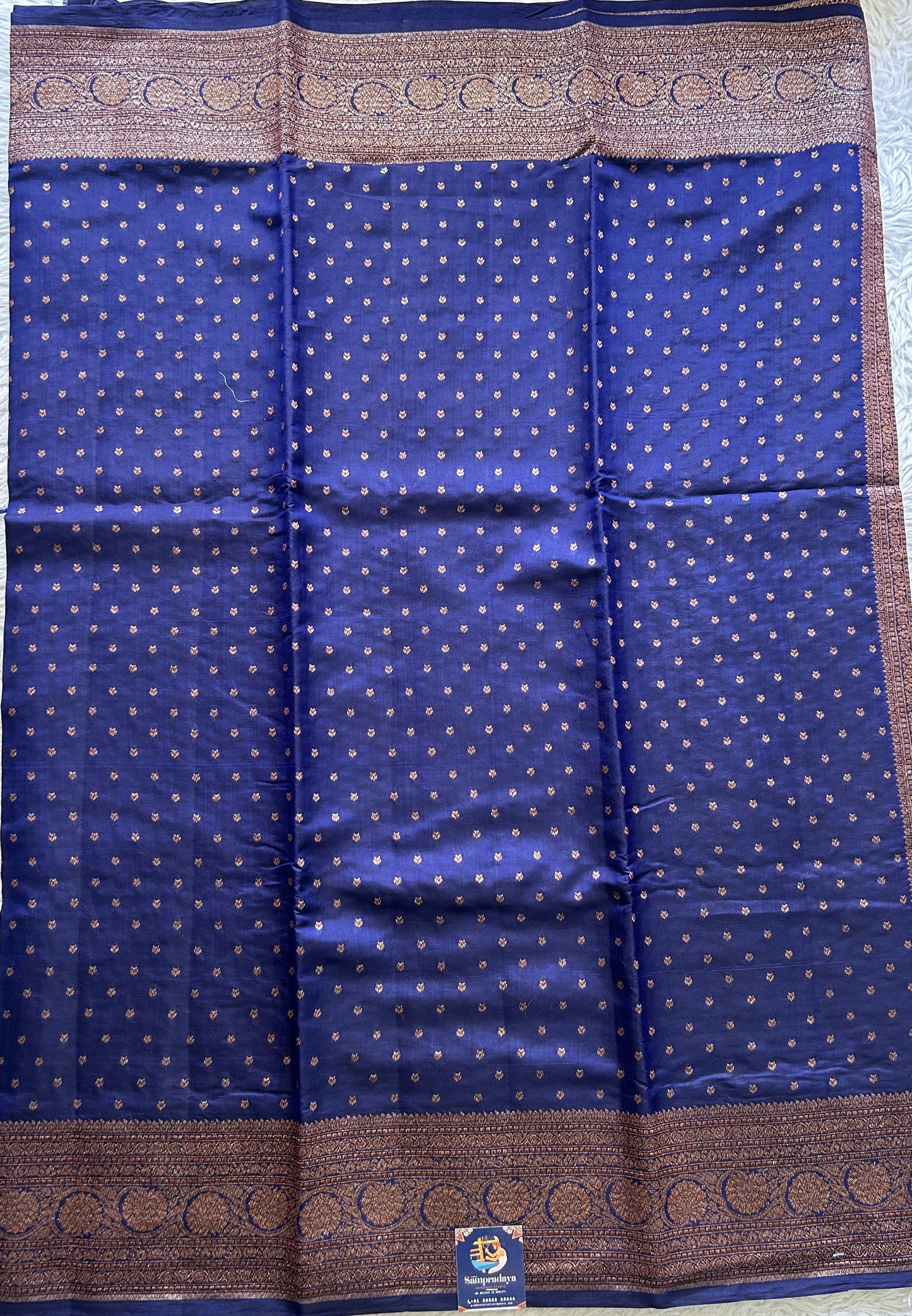 Raw Mango or Pooniya Silk Saree Ink Blue Colored Complemented With a Zari Border - Sampradaya Designer Studio