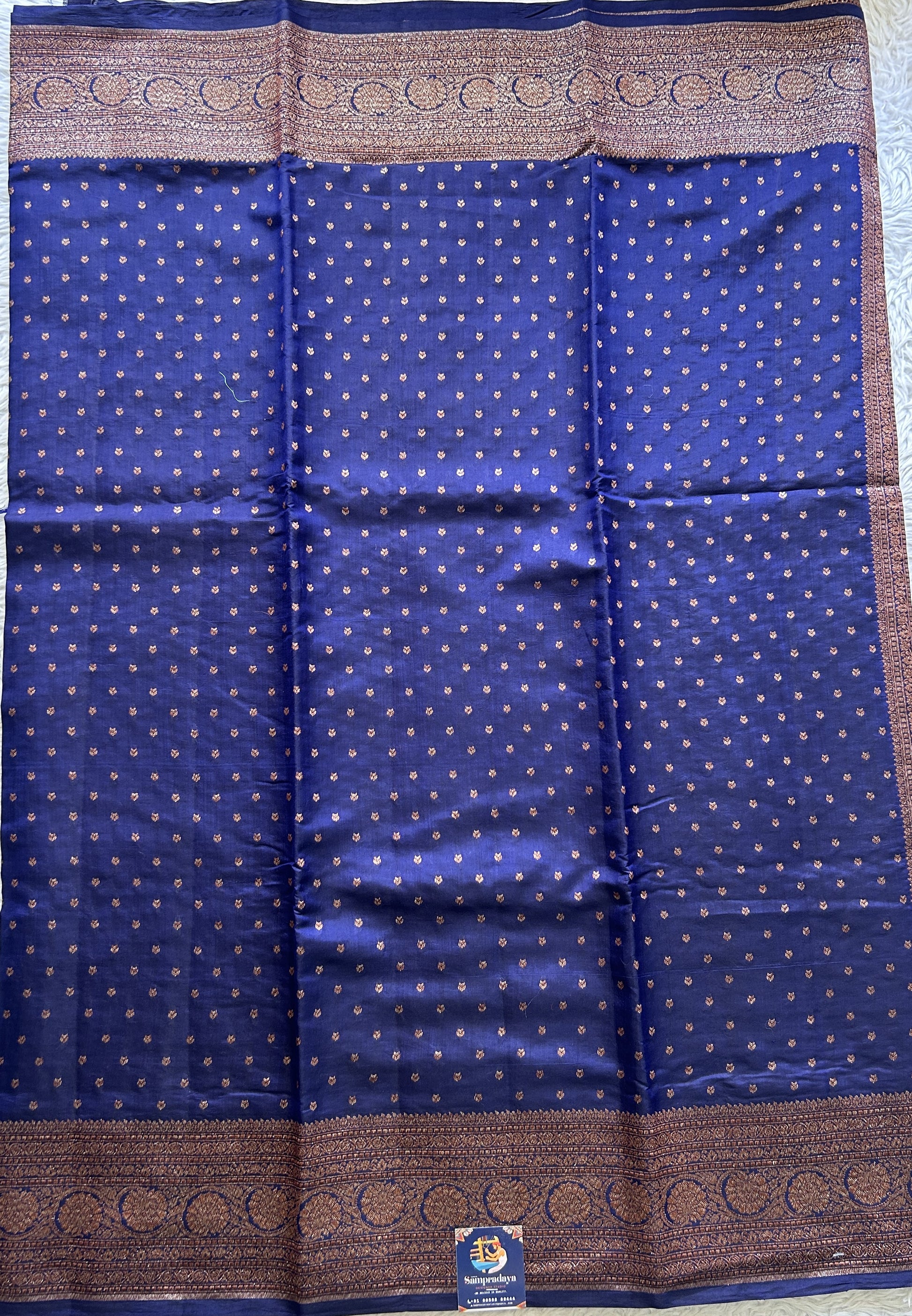 Raw Mango or Pooniya Silk Saree Ink Blue Colored Complemented With a Zari Border - Sampradaya Designer Studio
