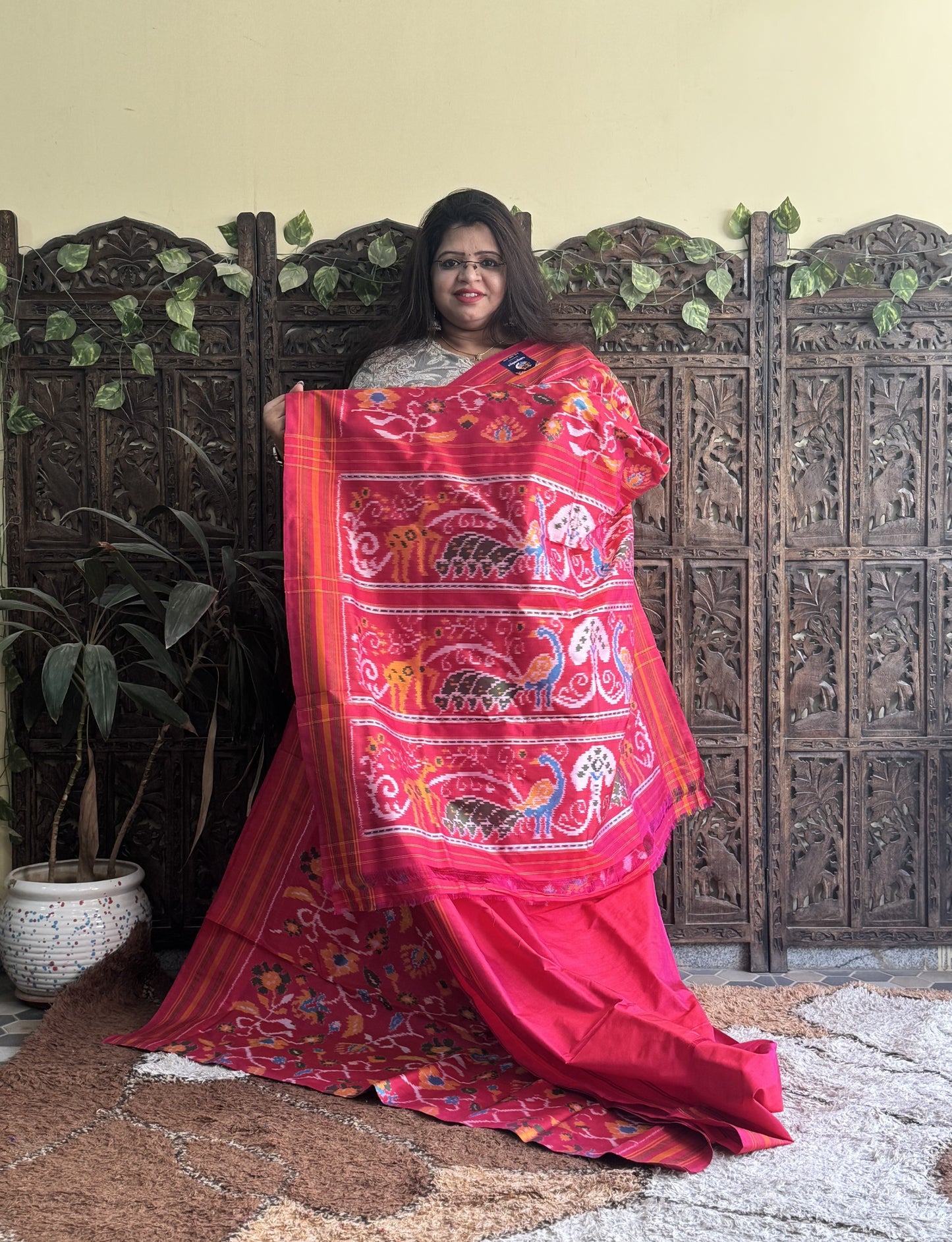 Ikkat Pattu Saree Hot Pink colored complemented with a Patola border. - Sampradaya Designer Studio