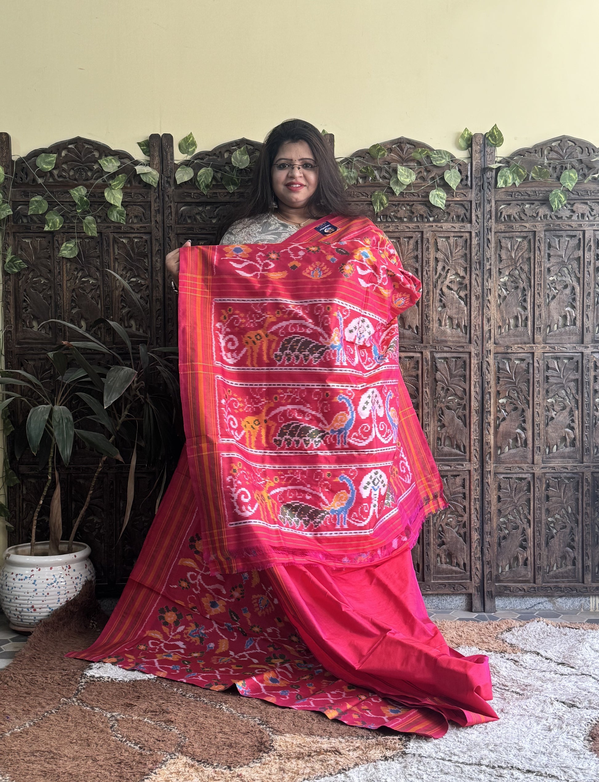 Ikkat Pattu Saree Hot Pink colored complemented with a Patola border. - Sampradaya Designer Studio