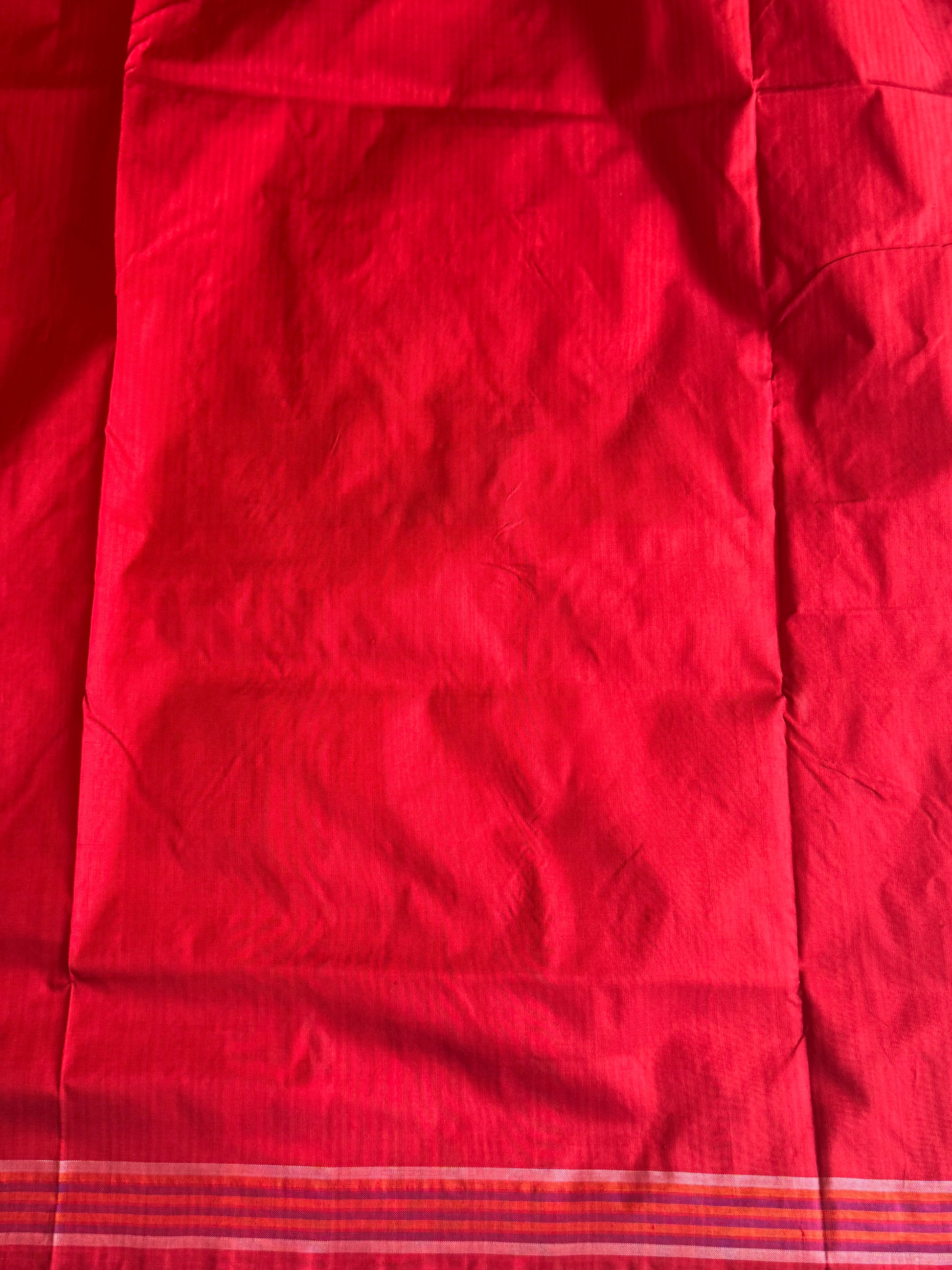 Ikkat Pattu Saree Violet colored complemented with a Red Patolla border. - Sampradaya Designer Studio