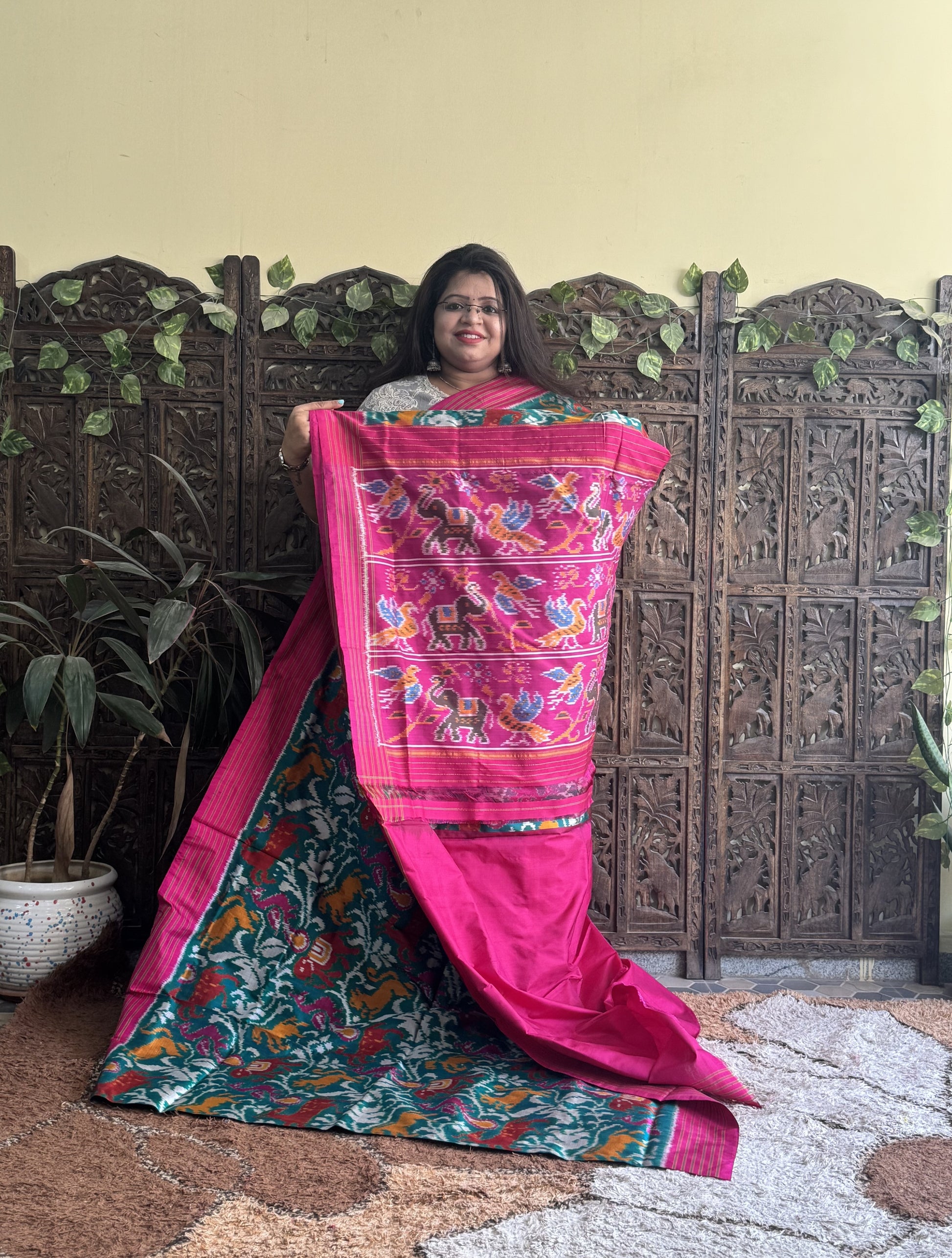 Ikkat Pattu Saree Green colored complemented with a Pink Patolla border. - Sampradaya Designer Studio